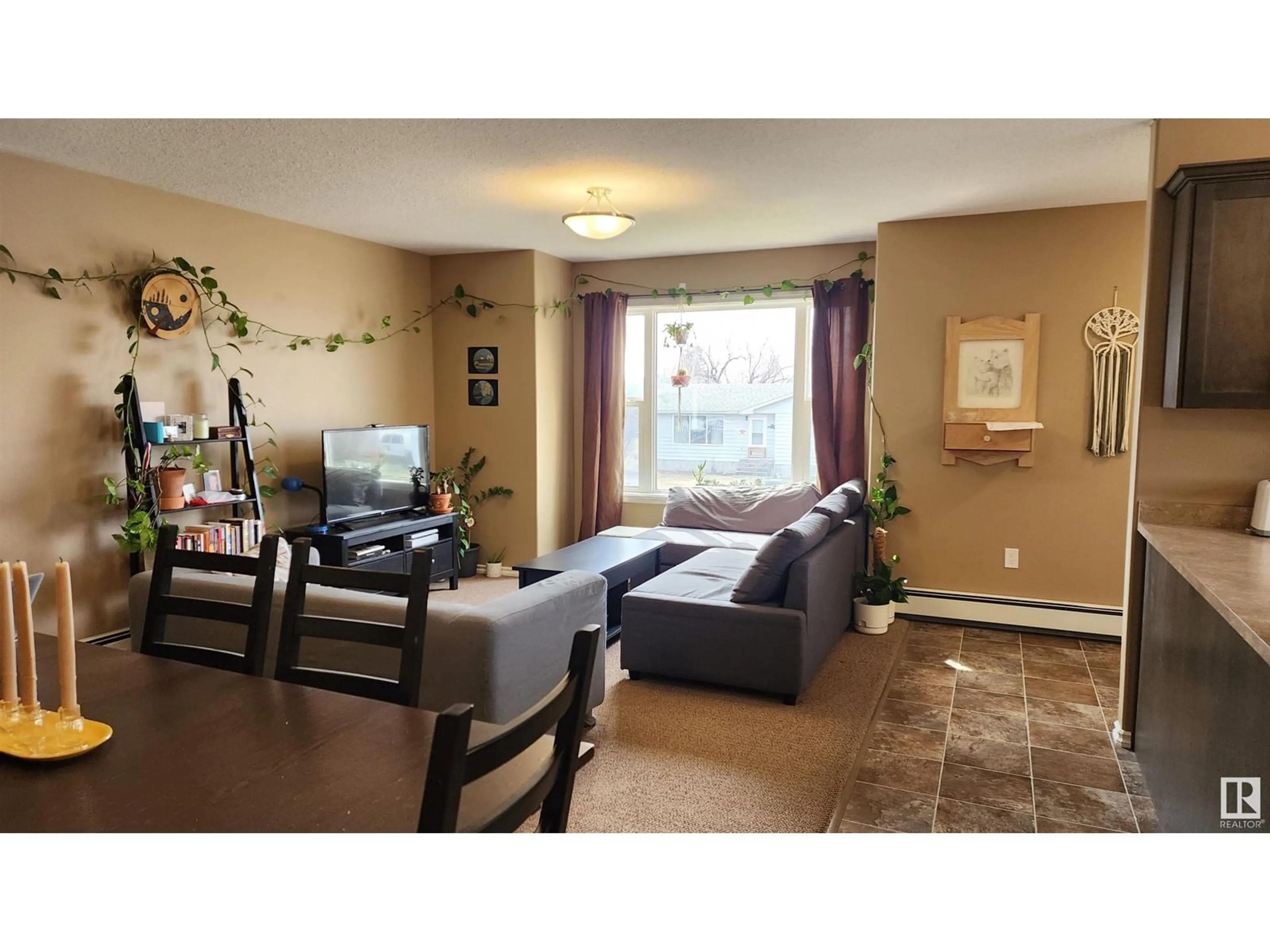 Living room with furniture, wood/laminate floor for 4910 51 AV, Elk Point Alberta T0A1A0
