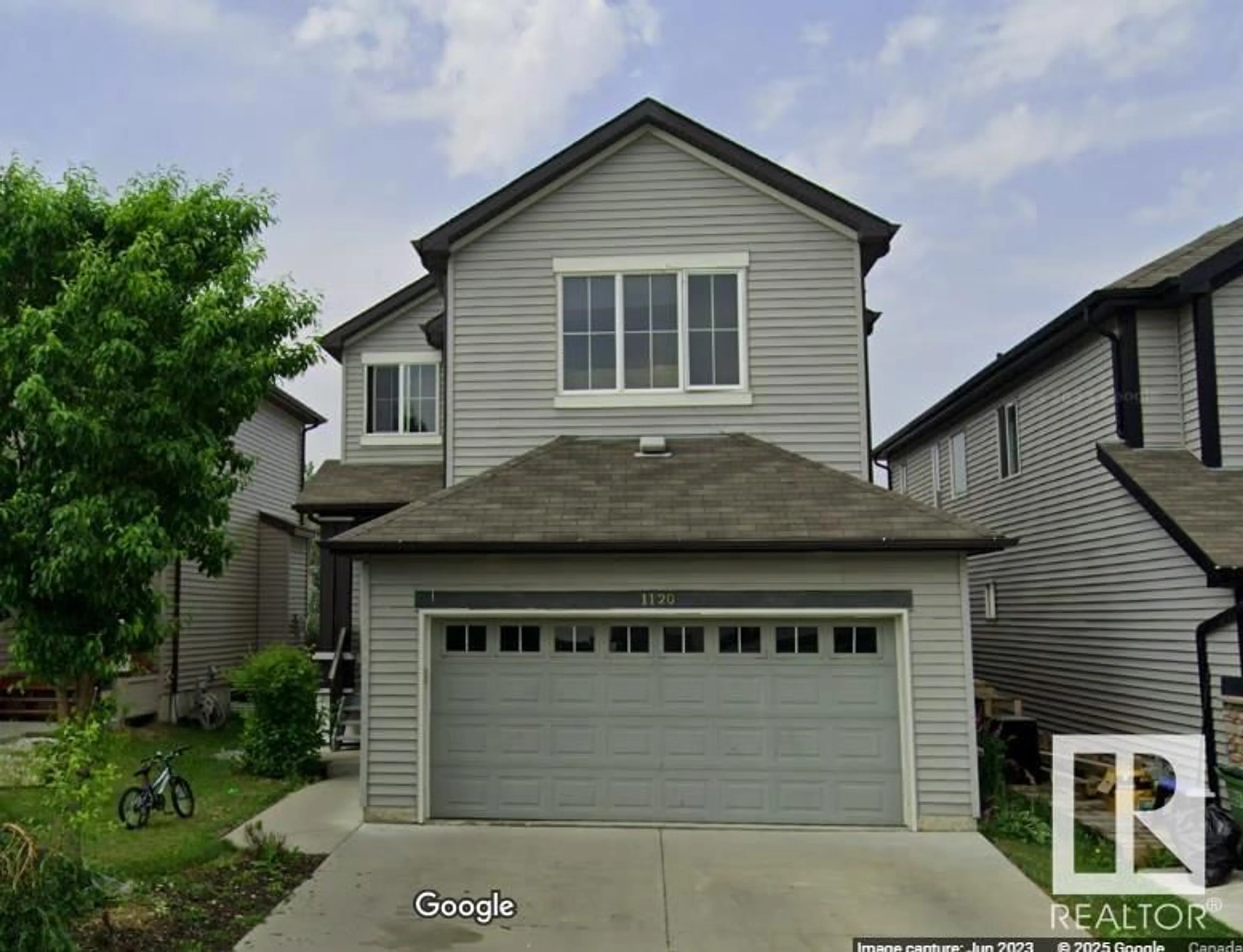 Home with vinyl exterior material, street for 1120 59 ST, Edmonton Alberta T6X0T3