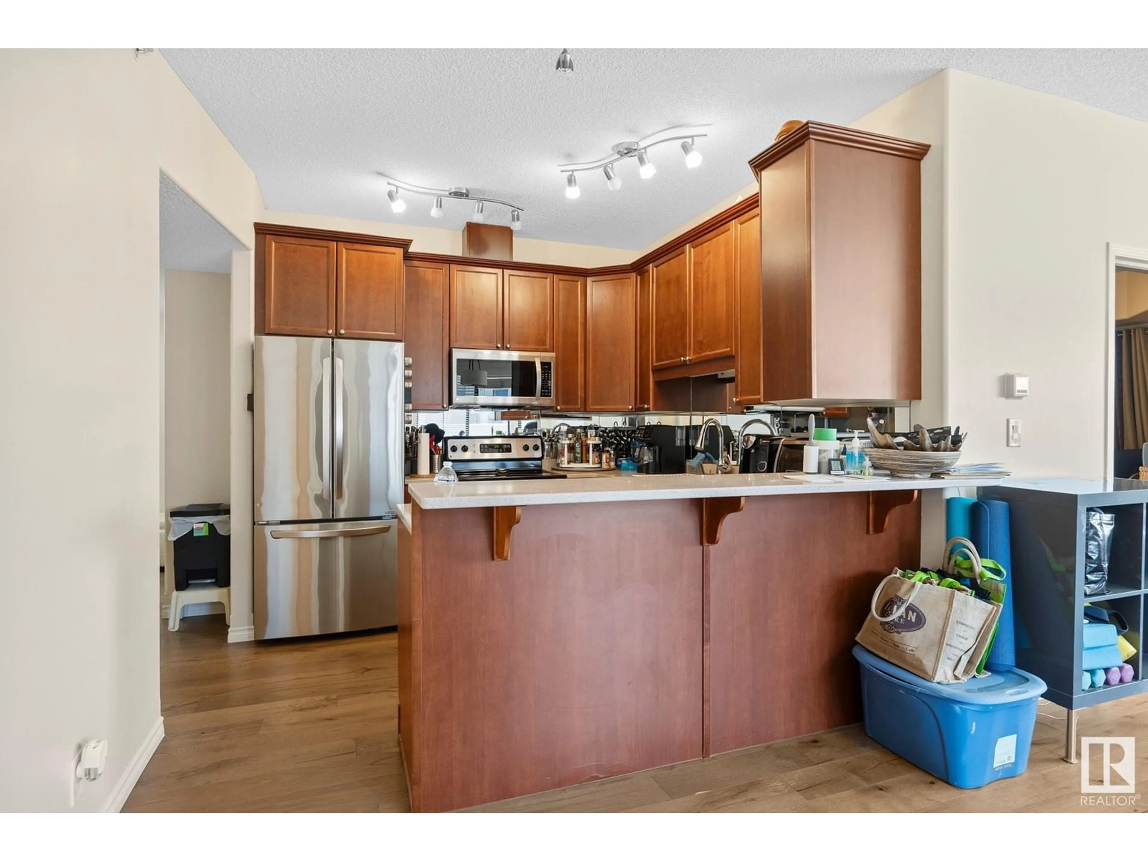 Open concept kitchen, wood/laminate floor for #502 - 10319 111 ST, Edmonton Alberta T5K0A2