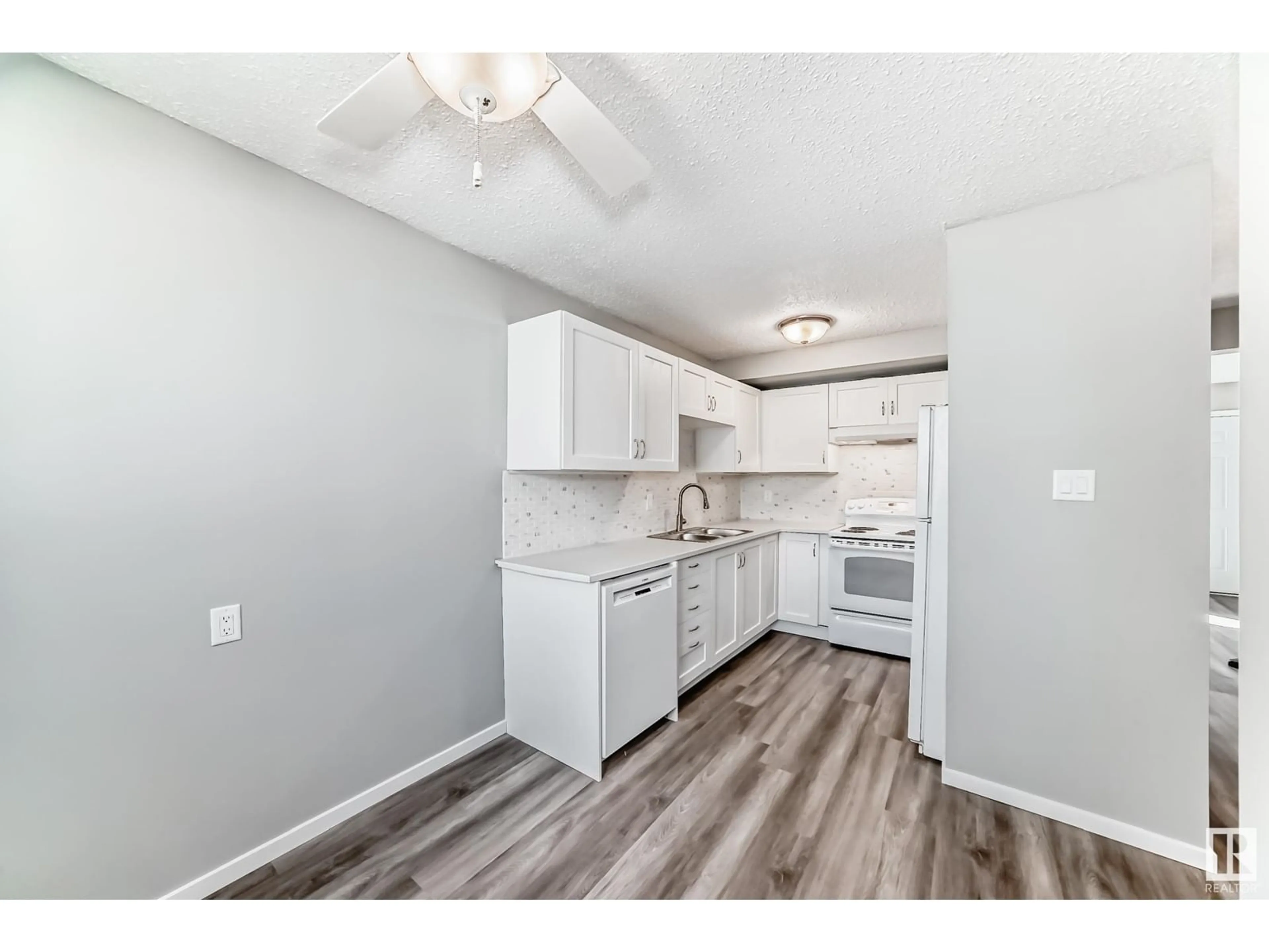Standard kitchen, wood/laminate floor for #142 - 10633 31 AV, Edmonton Alberta T6J4N4