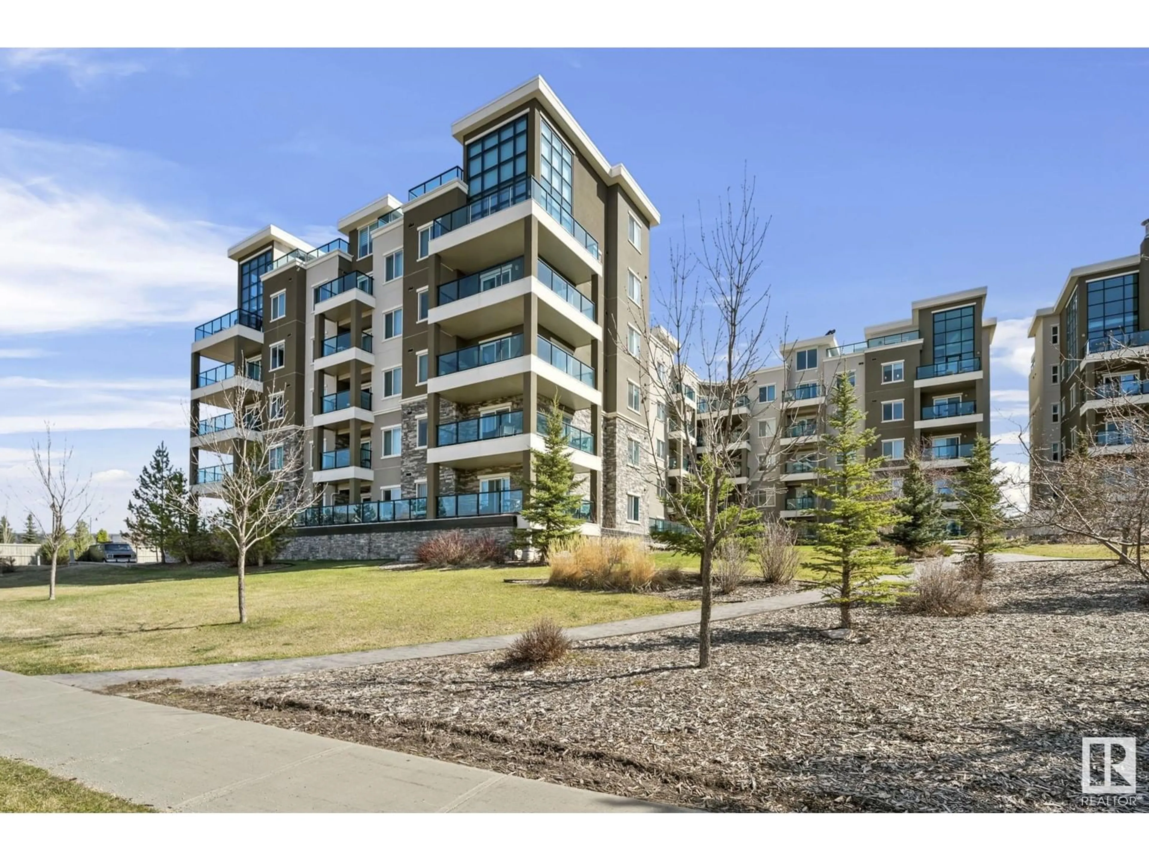A pic from outside/outdoor area/front of a property/back of a property/a pic from drone, unknown for #114 - 1230 WINDERMERE WY, Edmonton Alberta T6W2J3