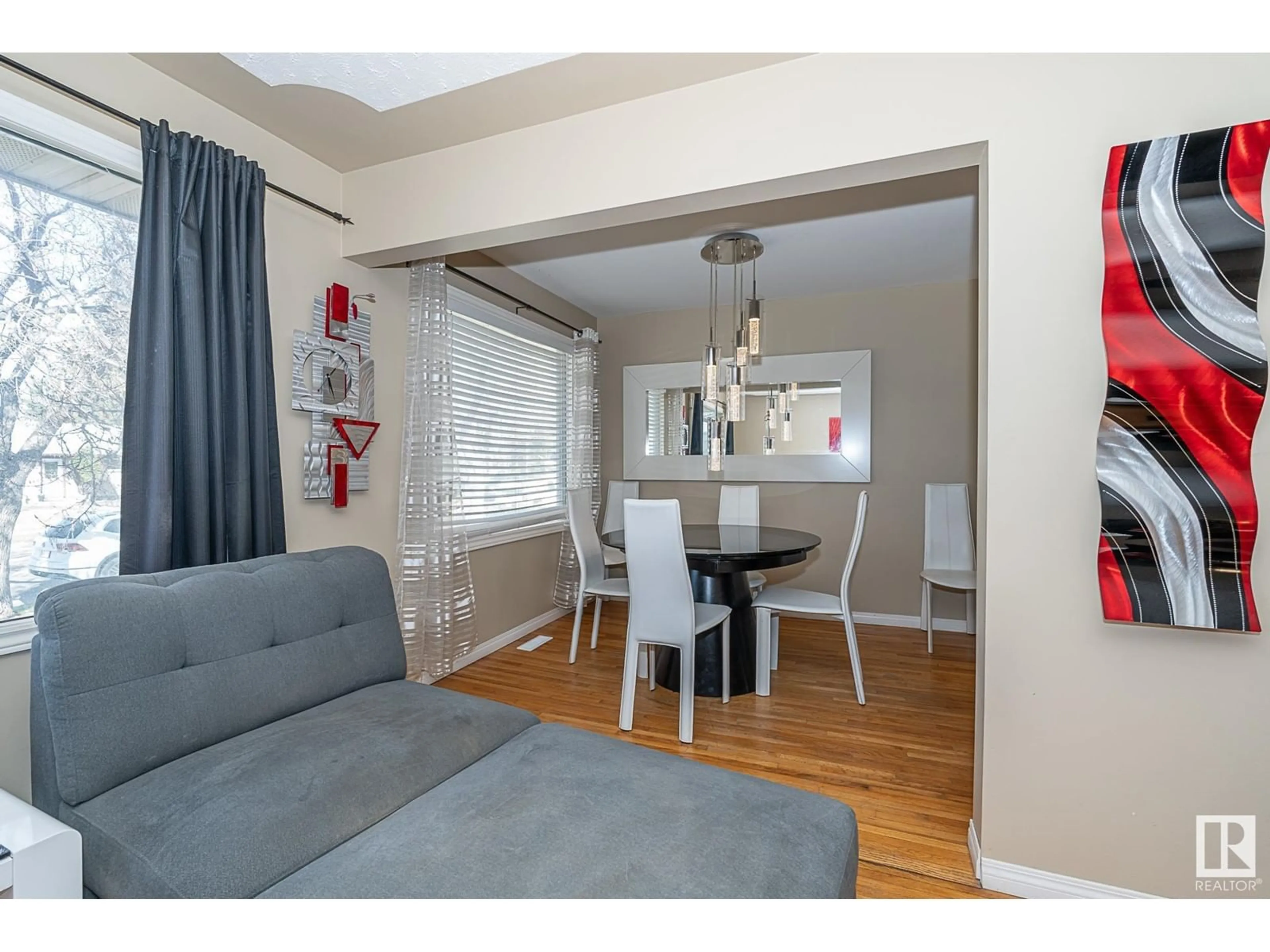 Living room with furniture, wood/laminate floor for NW - 16533 105A AV, Edmonton Alberta T5P0V6