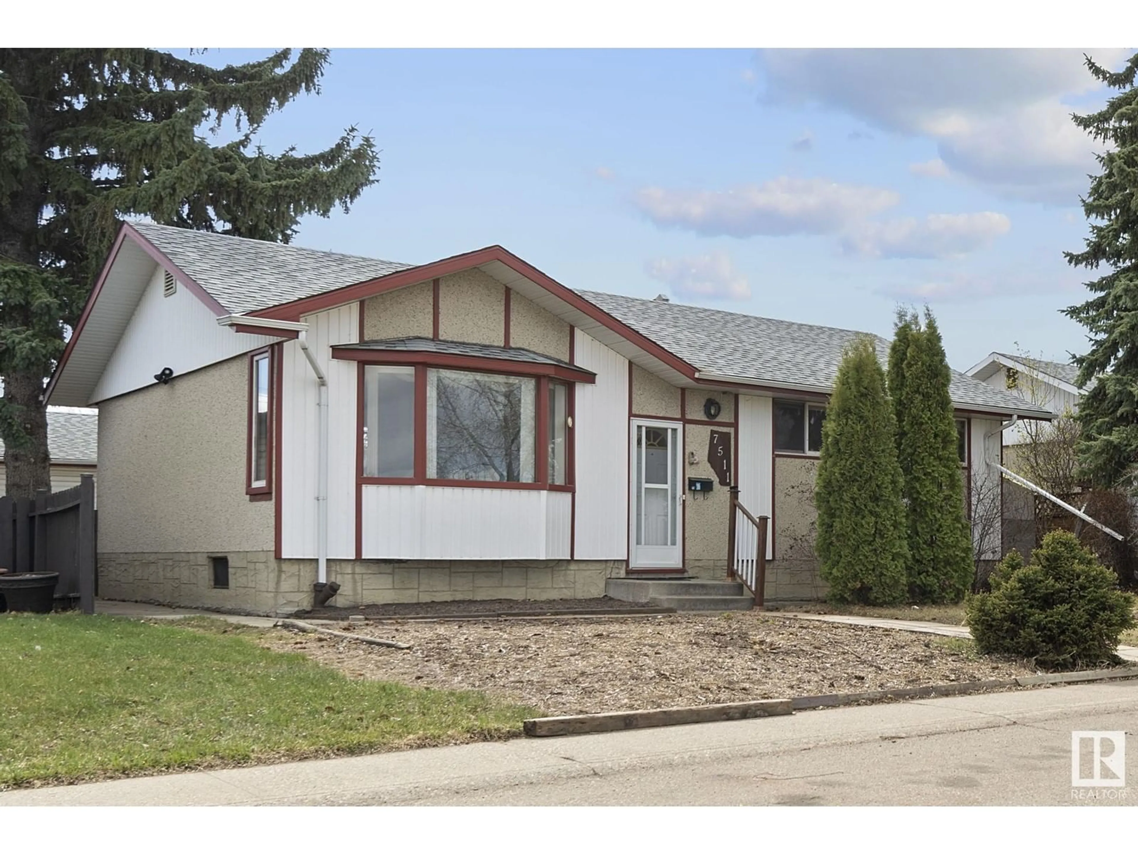 Home with vinyl exterior material, street for 7511 132 AV, Edmonton Alberta T5C3C6