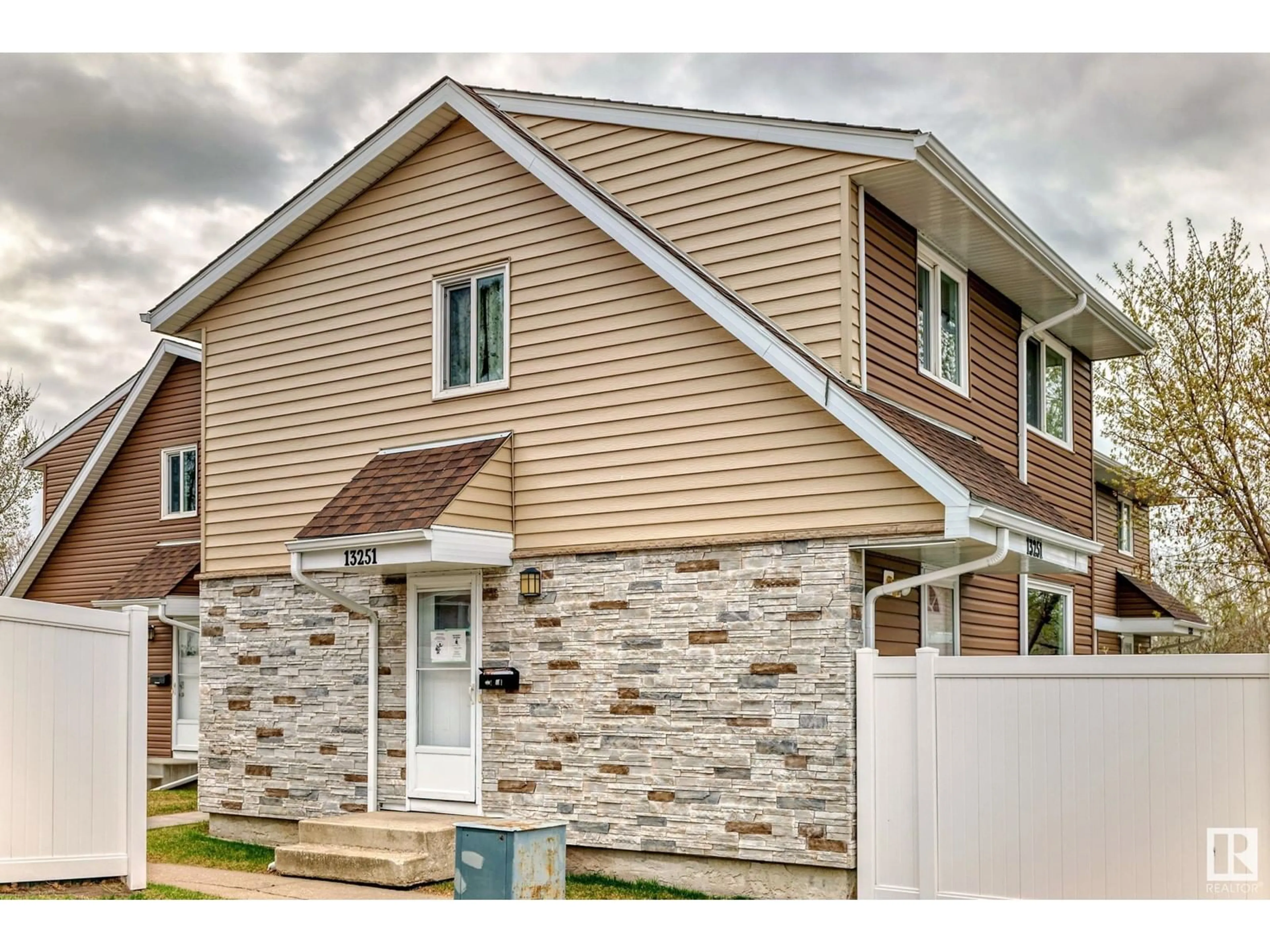 Home with vinyl exterior material, street for NW - 13251 47 ST, Edmonton Alberta T5A3L5
