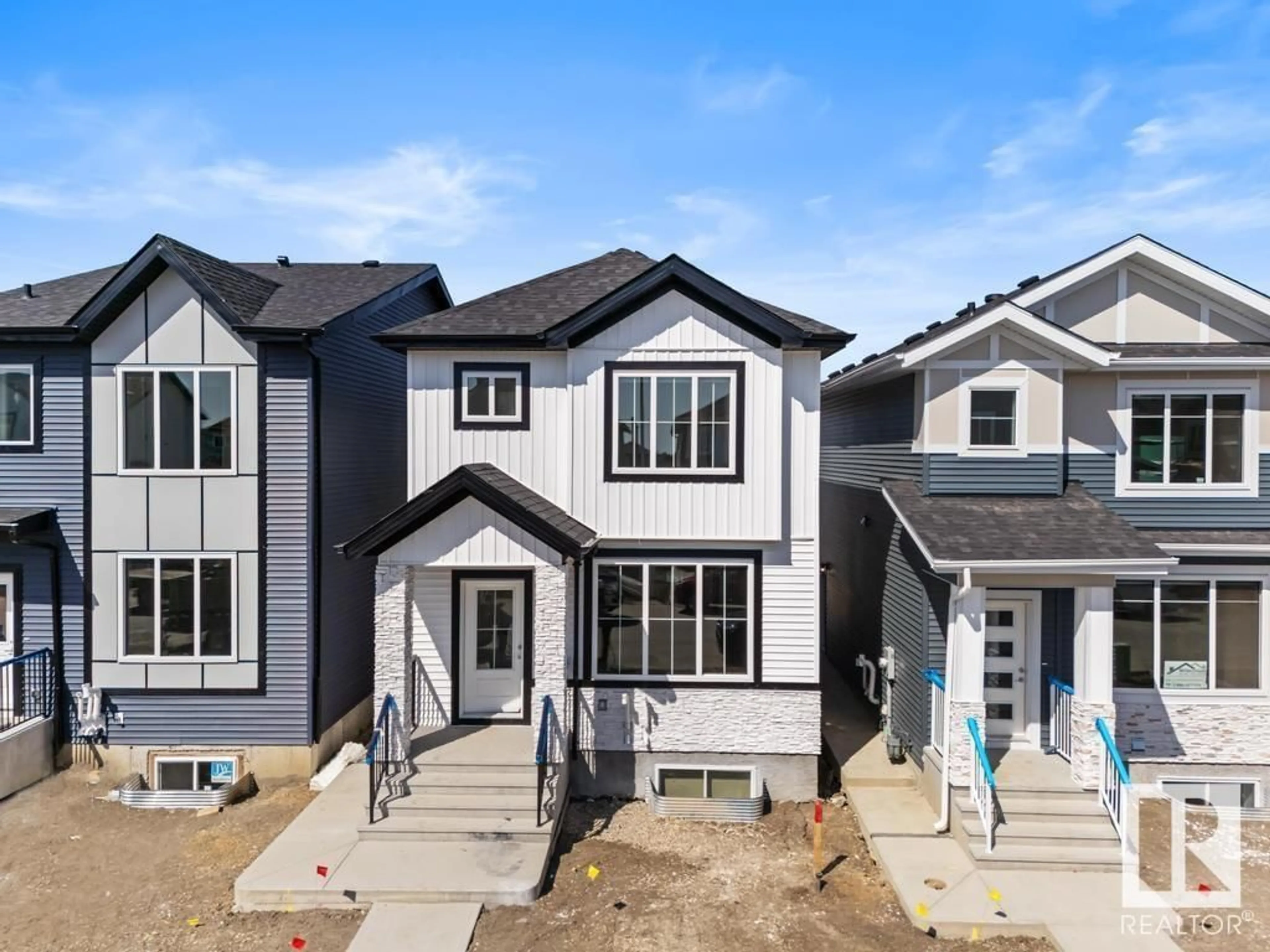 Home with vinyl exterior material, street for 186 STARLING, Fort Saskatchewan Alberta T8L1X5