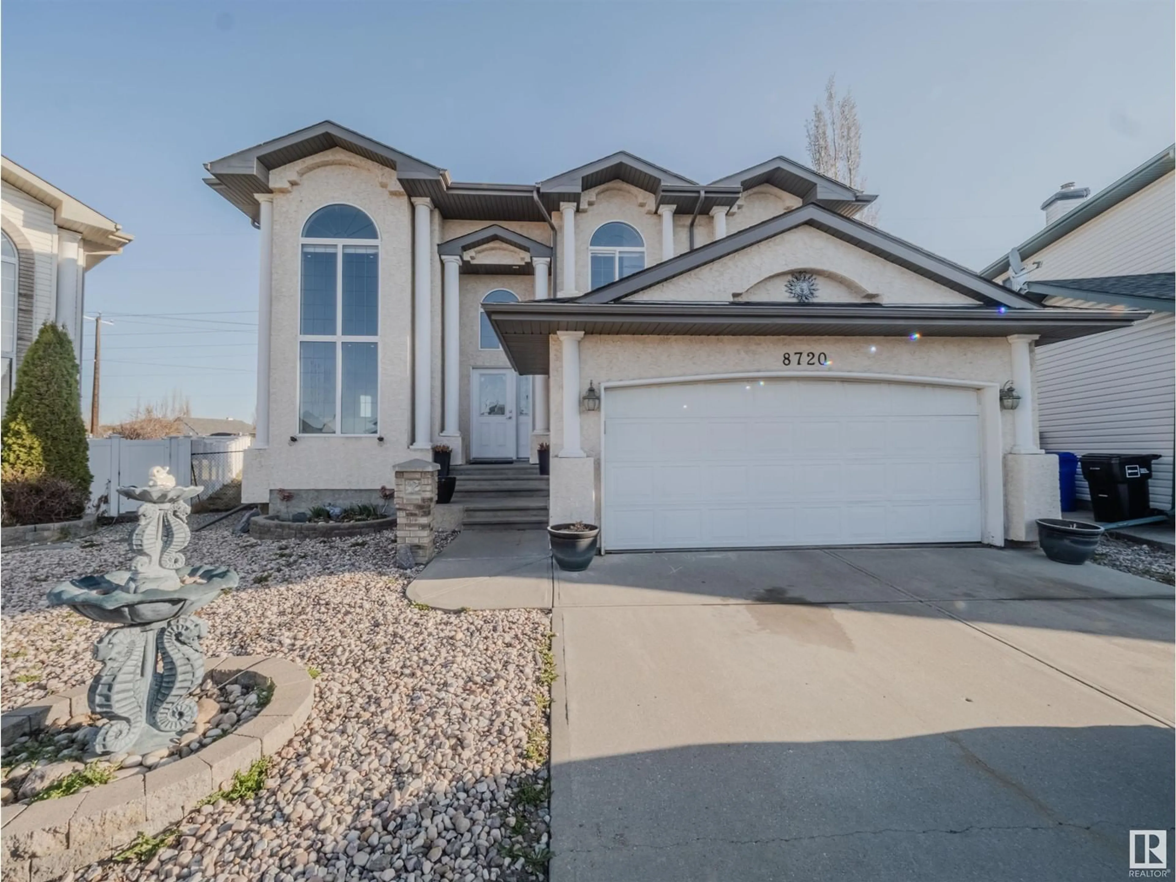 Home with vinyl exterior material, street for 8720 163 AV, Edmonton Alberta T5X3K5