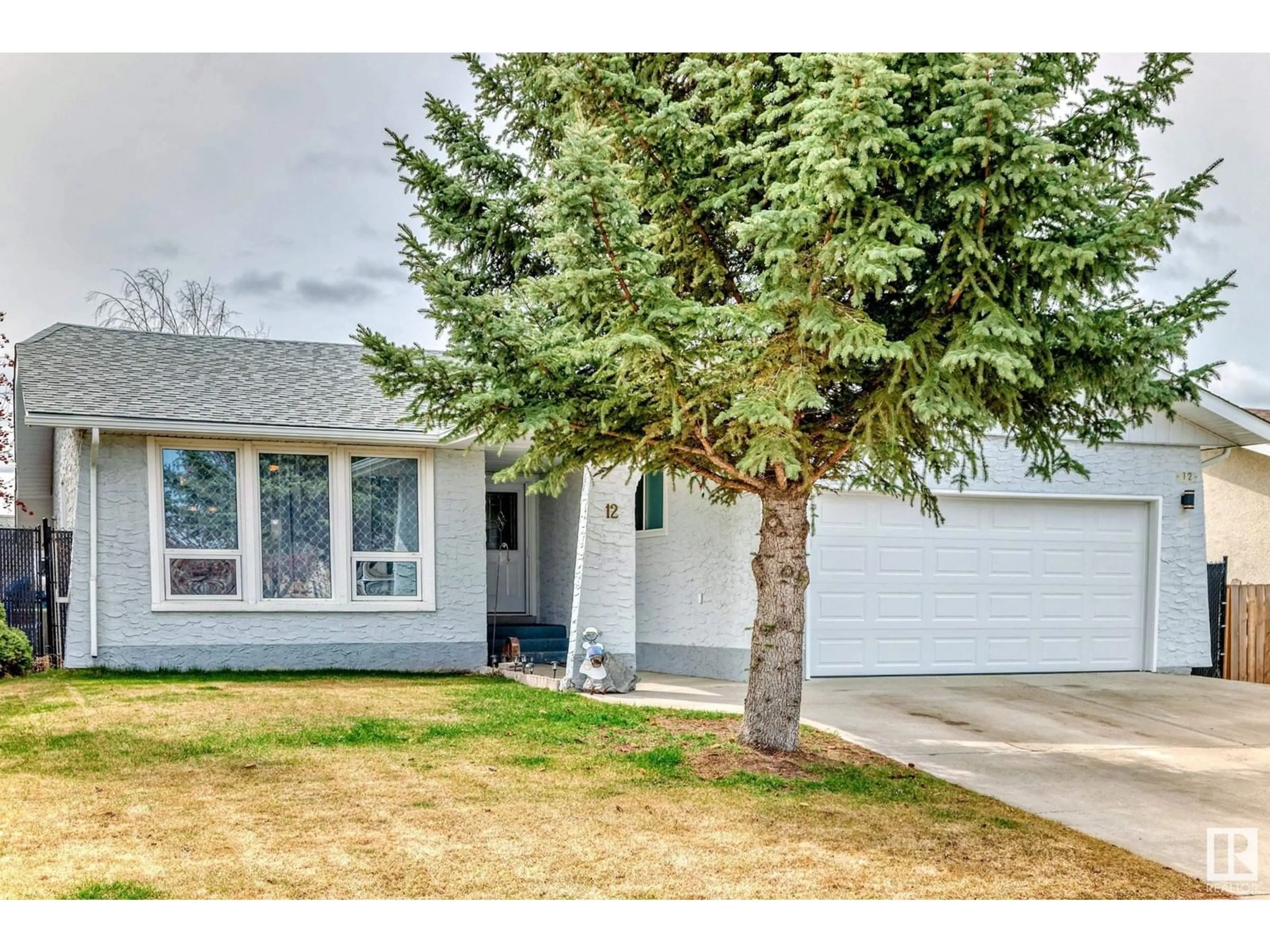 Home with vinyl exterior material, street for 12 MILLGROVE DR, Spruce Grove Alberta T7X2M2