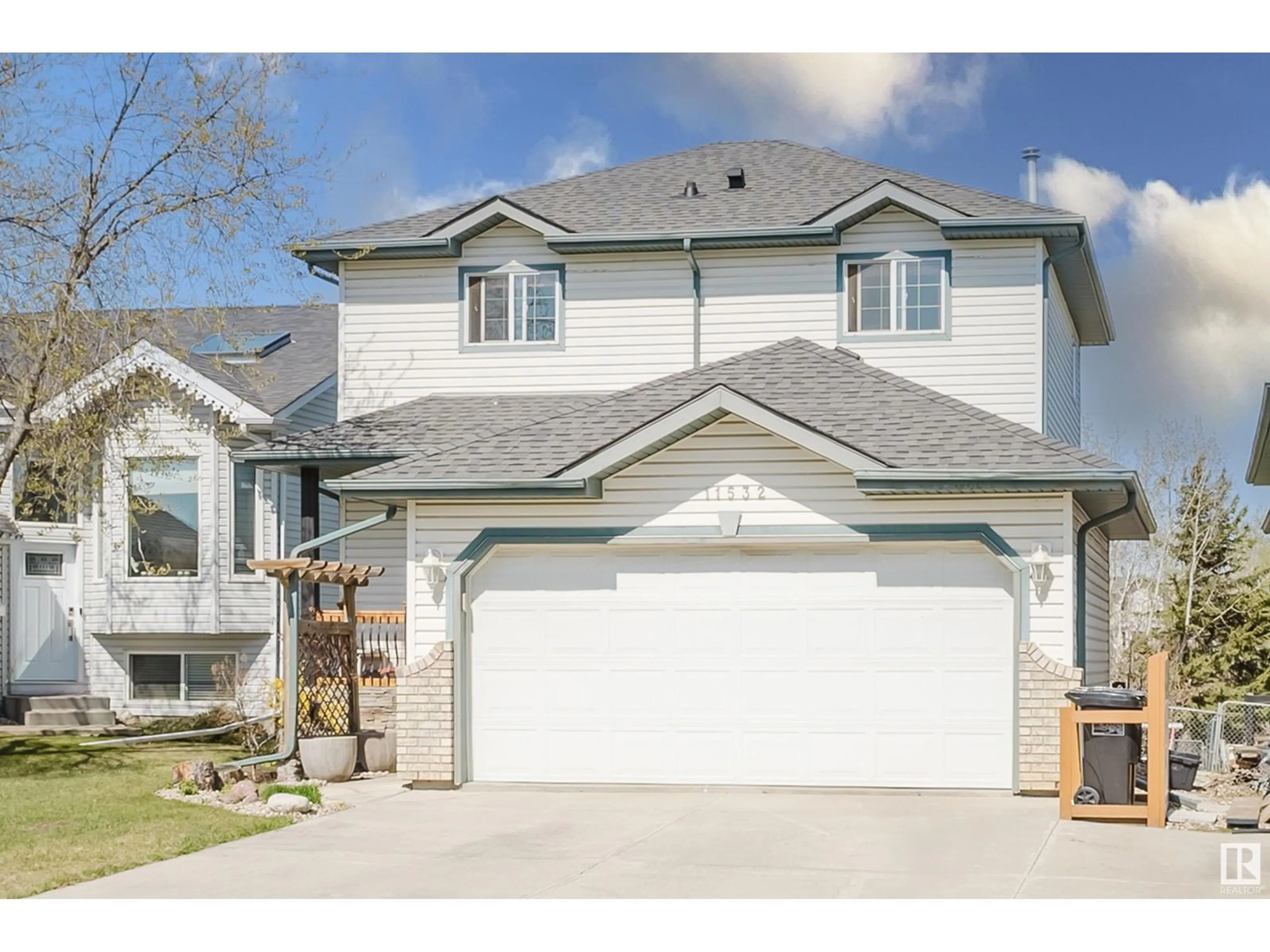 Home with vinyl exterior material, street for 11532 170 AV, Edmonton Alberta T5X5Z4