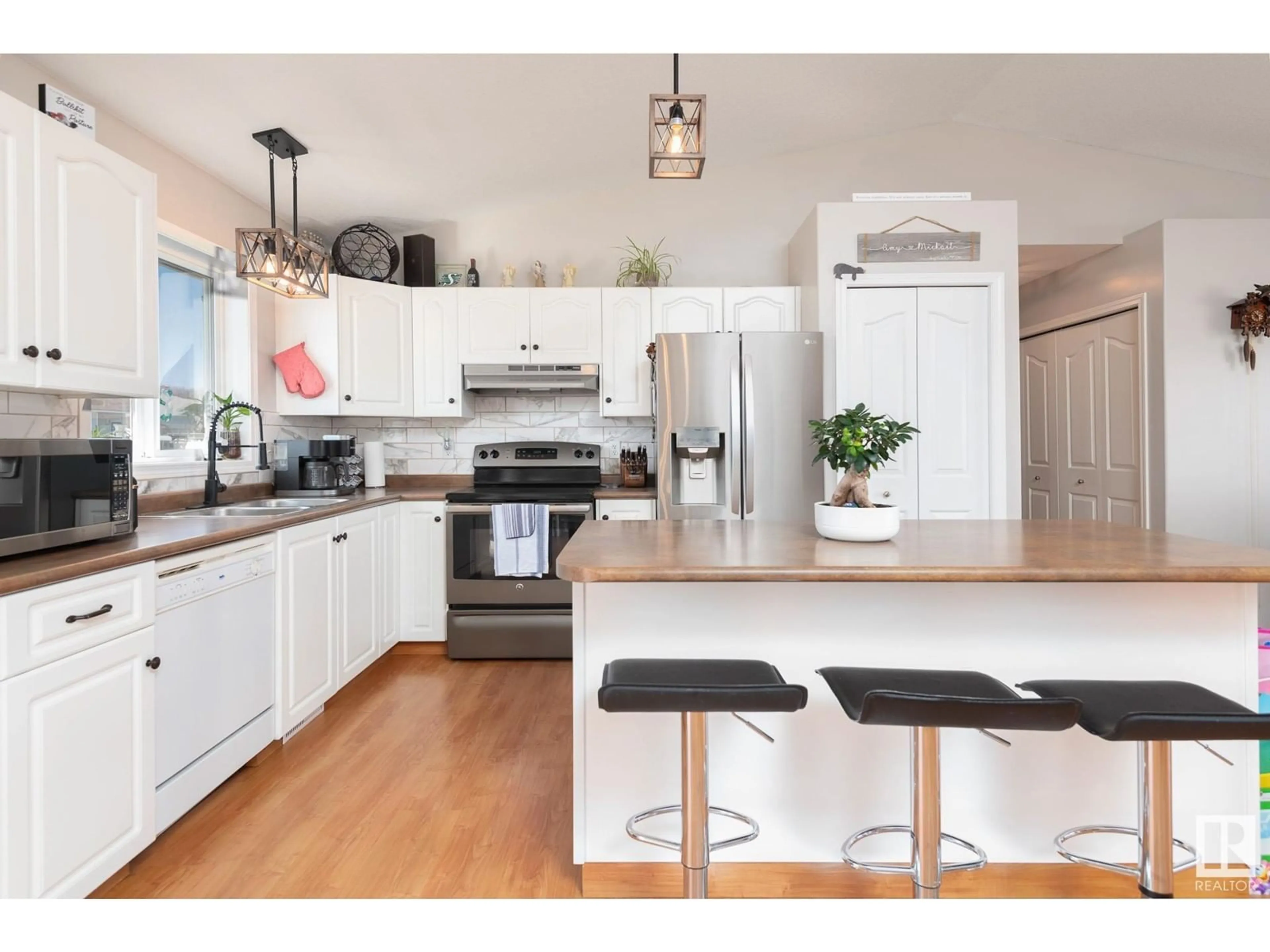 Open concept kitchen, wood/laminate floor for 2610 6A AV, Cold Lake Alberta T9M2C7