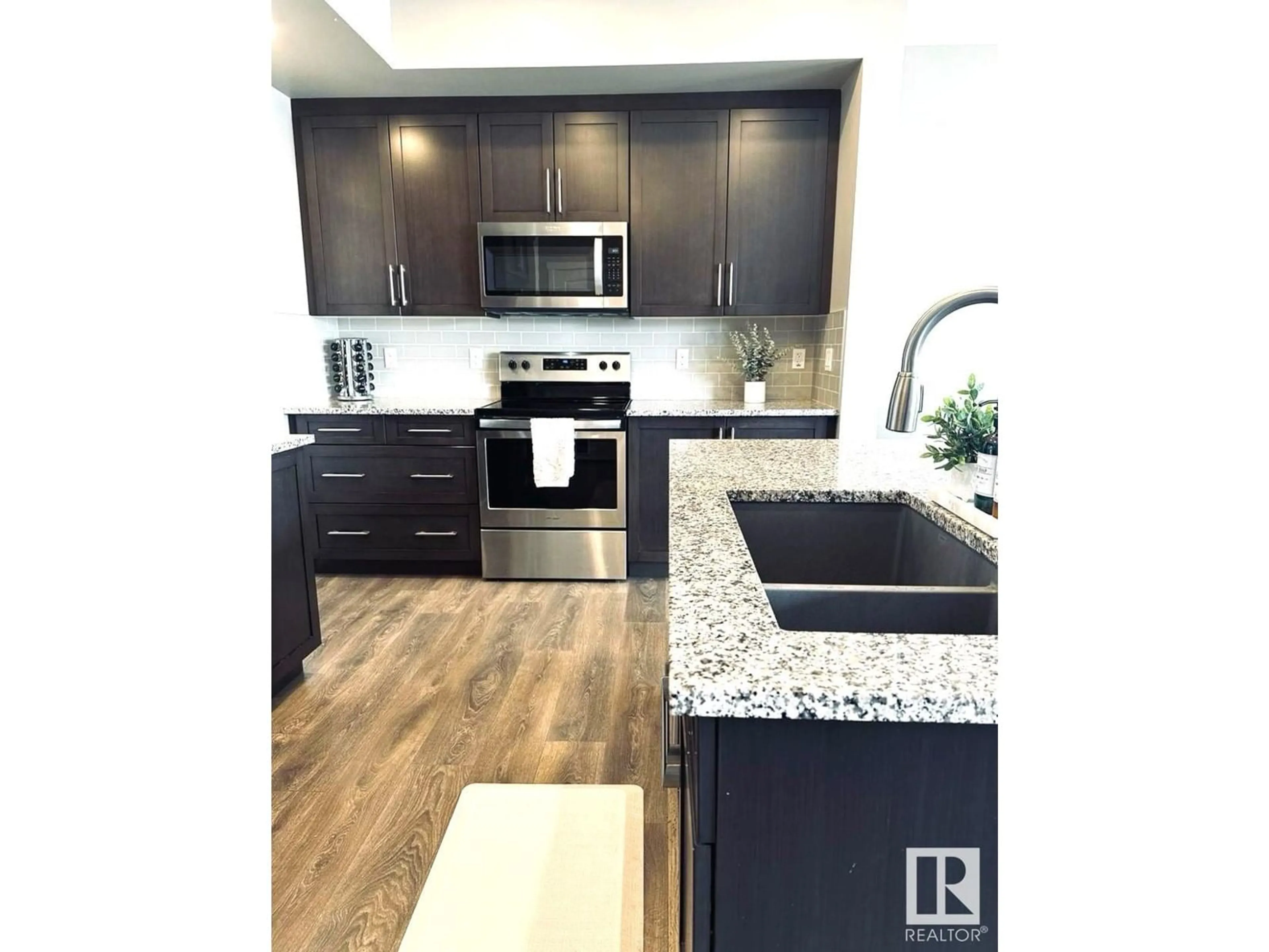 Contemporary kitchen, wood/laminate floor for NW - 22820 94B AV, Edmonton Alberta T5T7B3