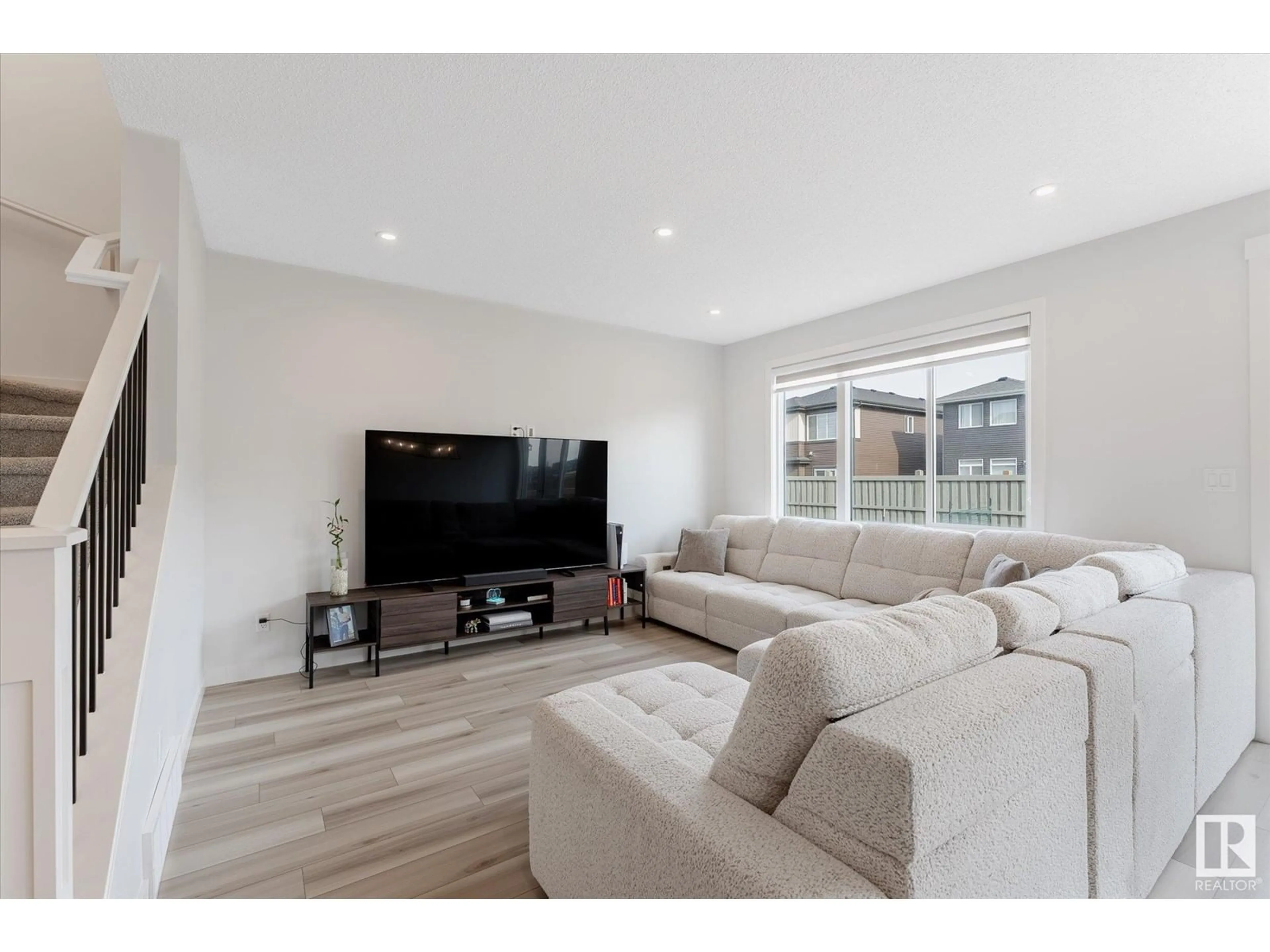 Living room with furniture, wood/laminate floor for 22056 80 AV, Edmonton Alberta T5T7H8