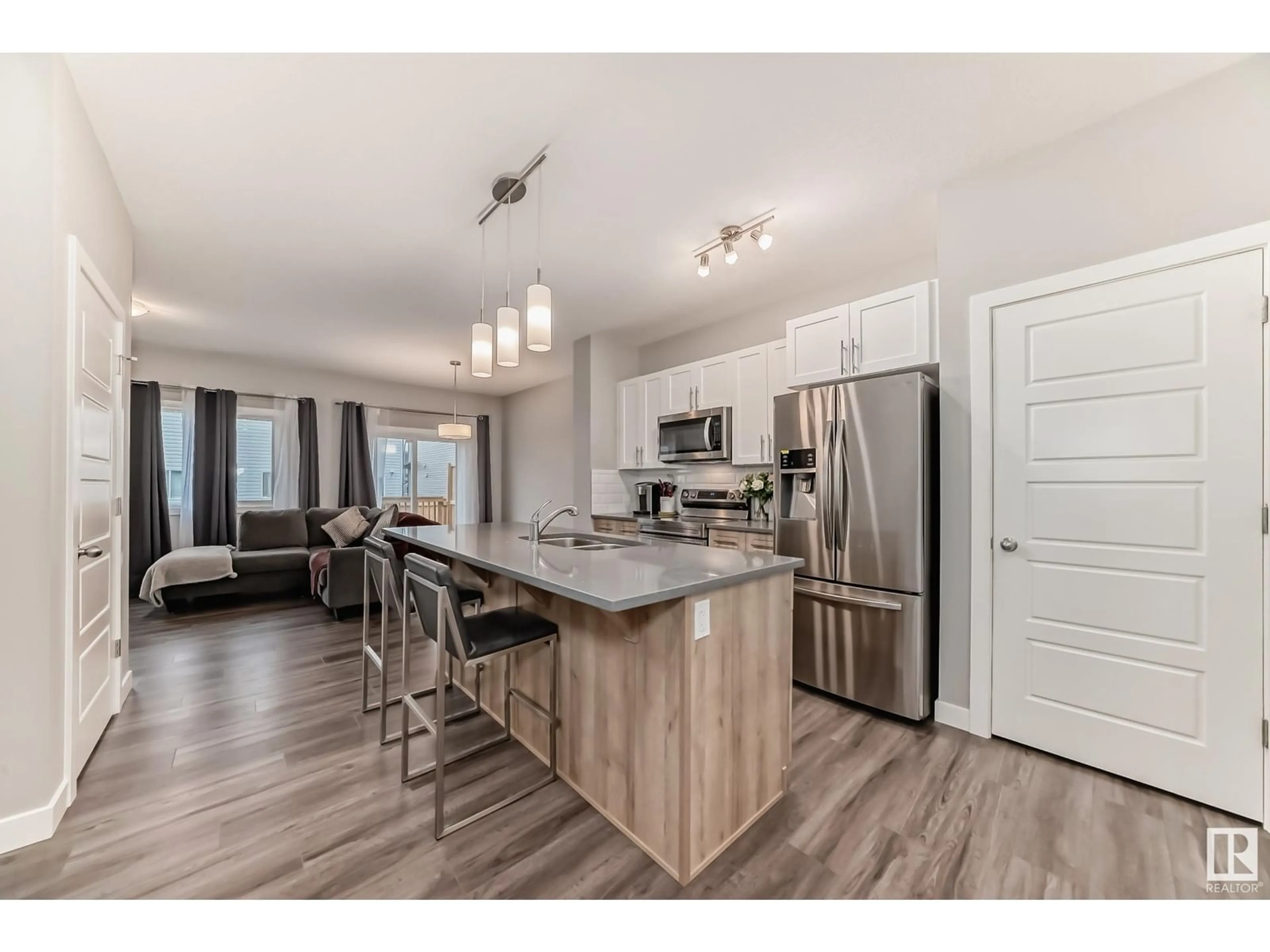 Open concept kitchen, wood/laminate floor for 40 HAMMETT GA, Spruce Grove Alberta T7X0V2