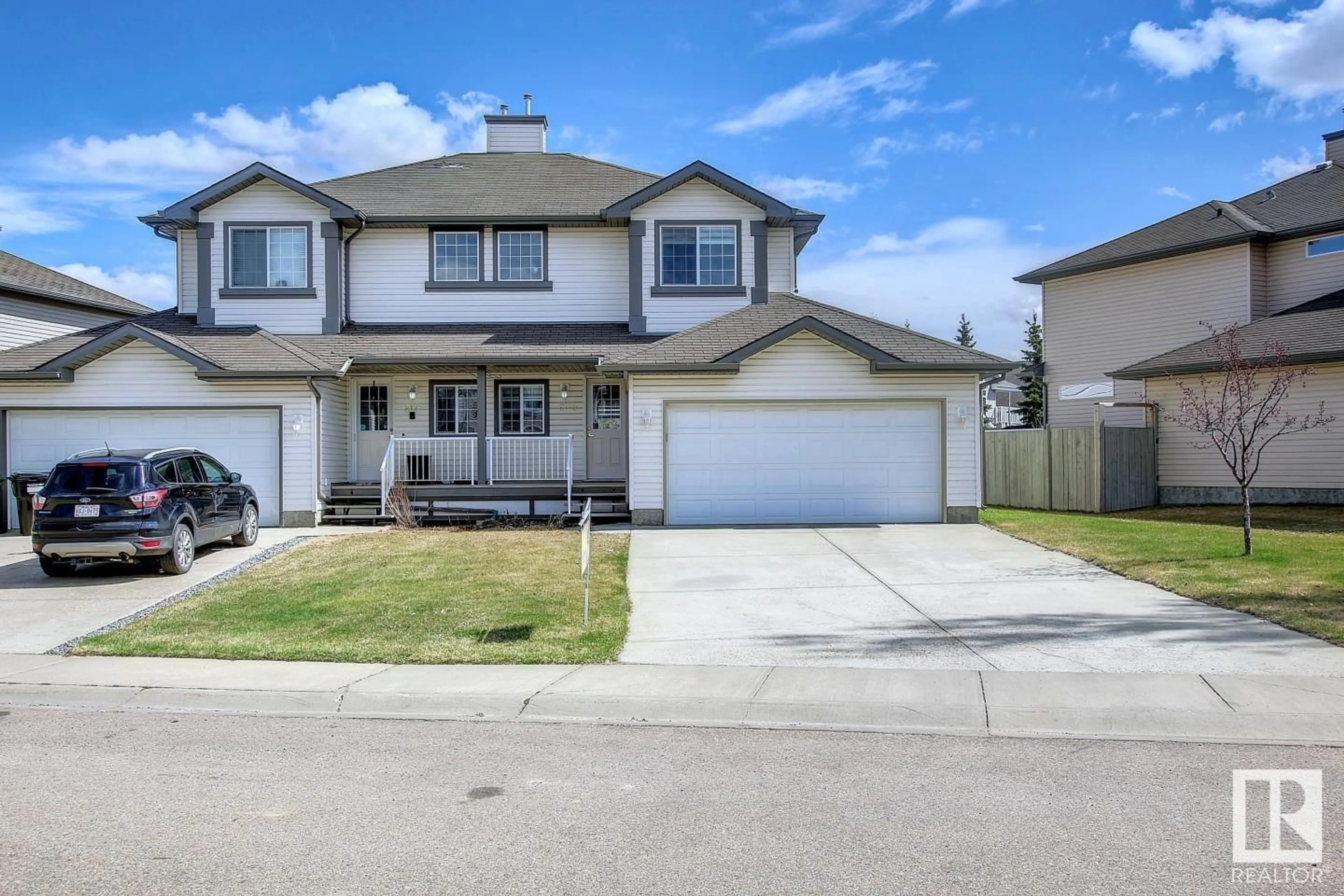 Home with vinyl exterior material, street for 8129 7 AV, Edmonton Alberta T6X1L9