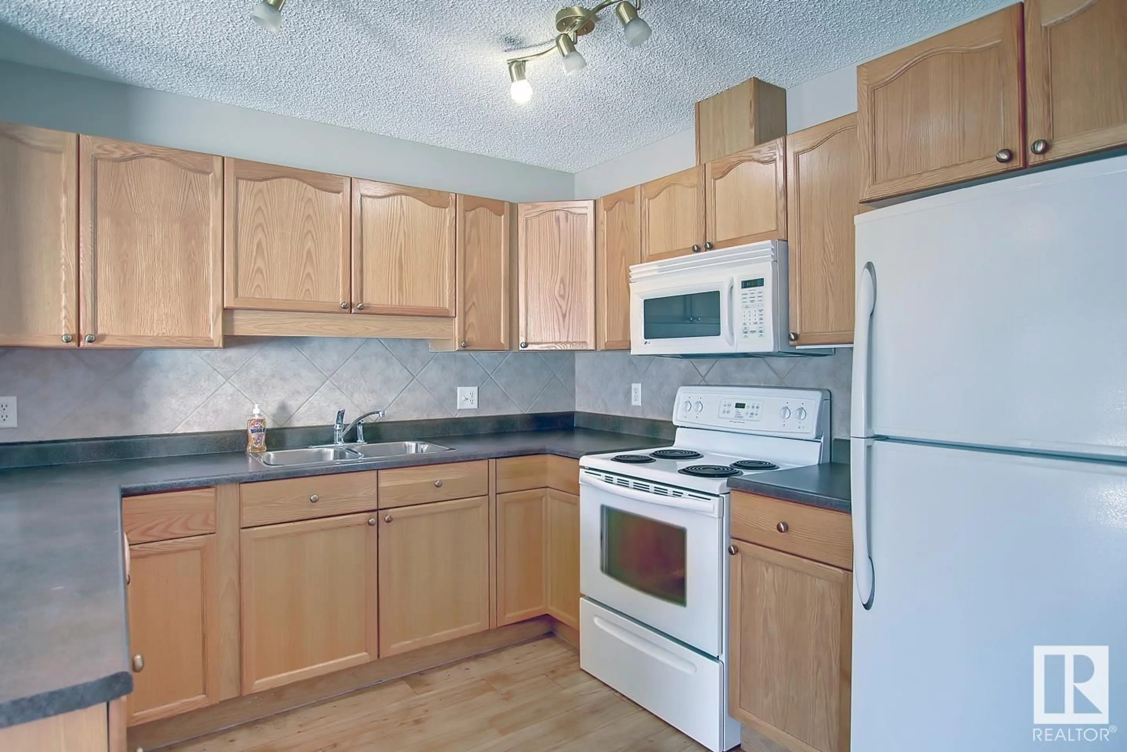 Standard kitchen, wood/laminate floor for 8129 7 AV, Edmonton Alberta T6X1L9