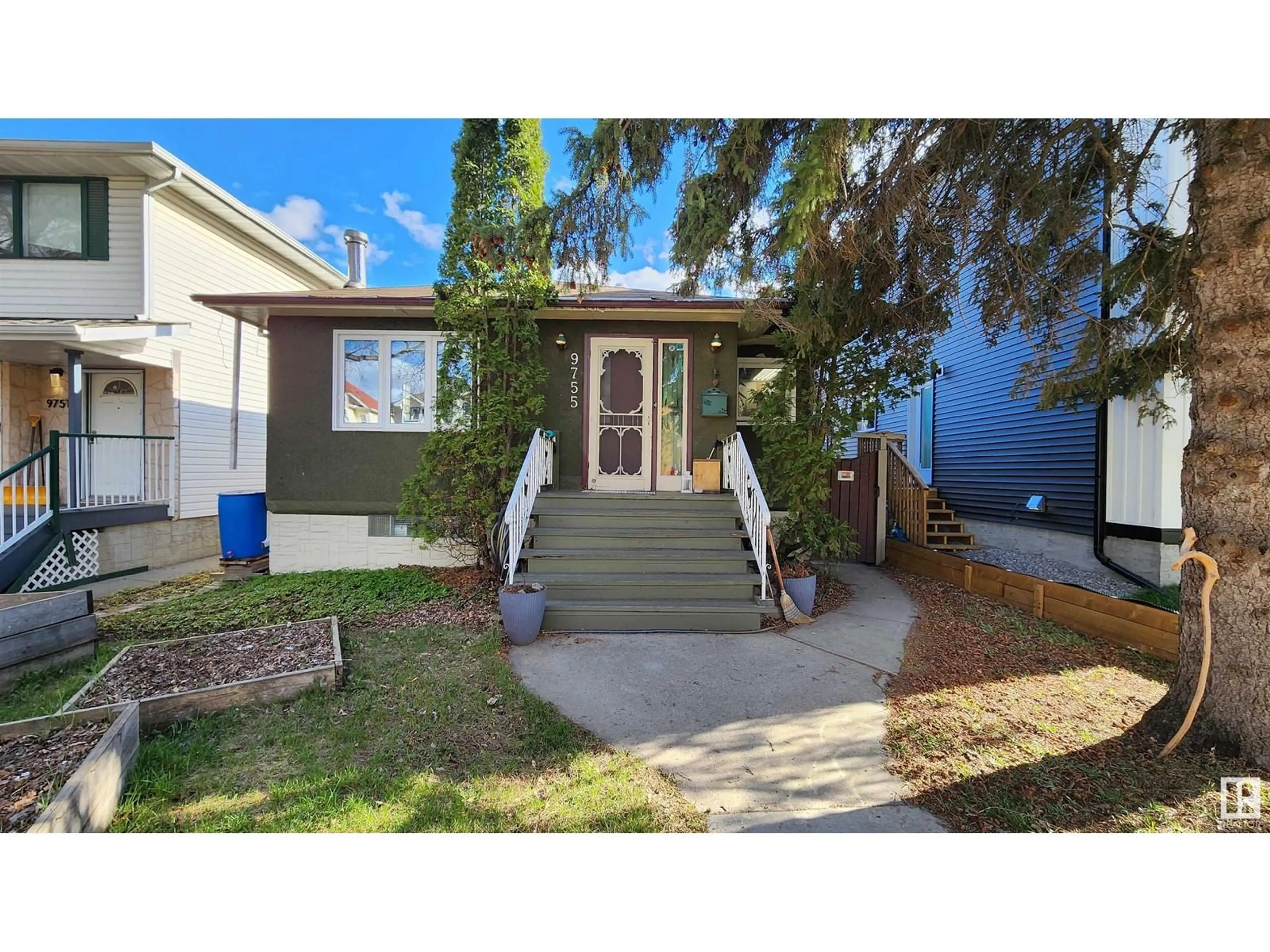 Home with vinyl exterior material, street for 9755 83 AV, Edmonton Alberta T6E2B6