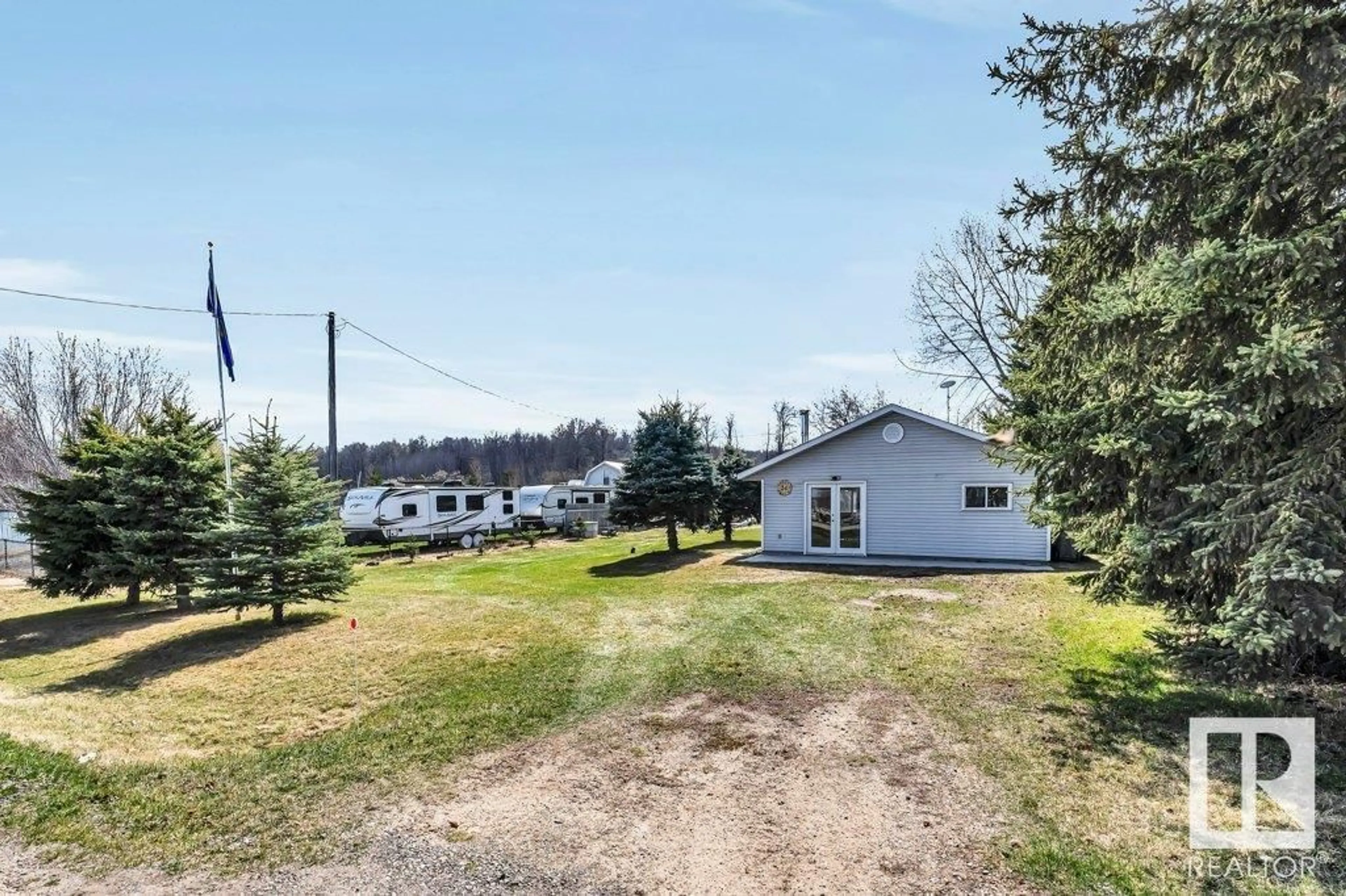 A pic from outside/outdoor area/front of a property/back of a property/a pic from drone, water/lake/river/ocean view for S.V. Grandview - 24 LAKESHORE DRIVE, Rural Wetaskiwin County Alberta T0C2V0