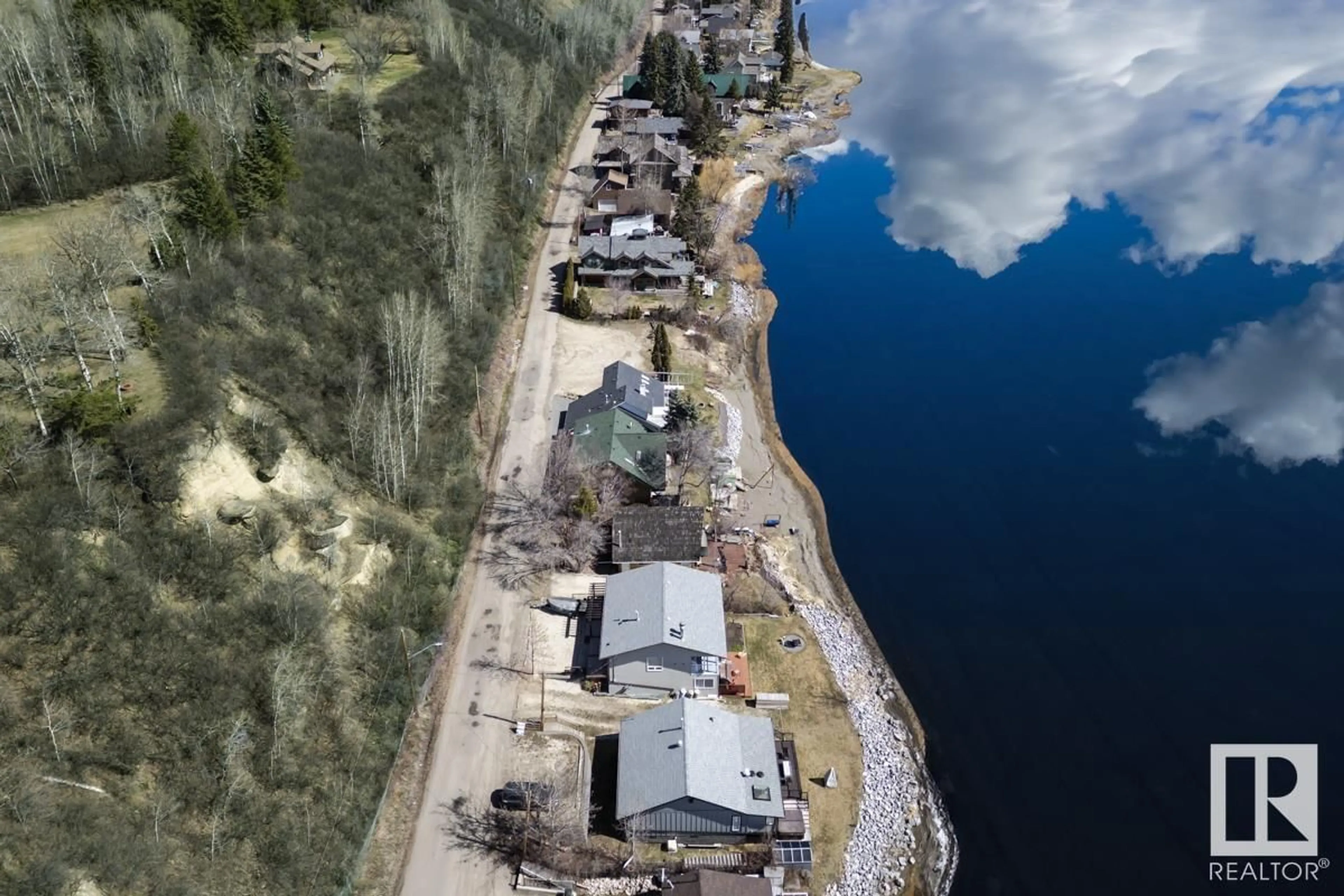 A pic from outside/outdoor area/front of a property/back of a property/a pic from drone, water/lake/river/ocean view for 457 1 AV, Rural Parkland County Alberta T0E2B0