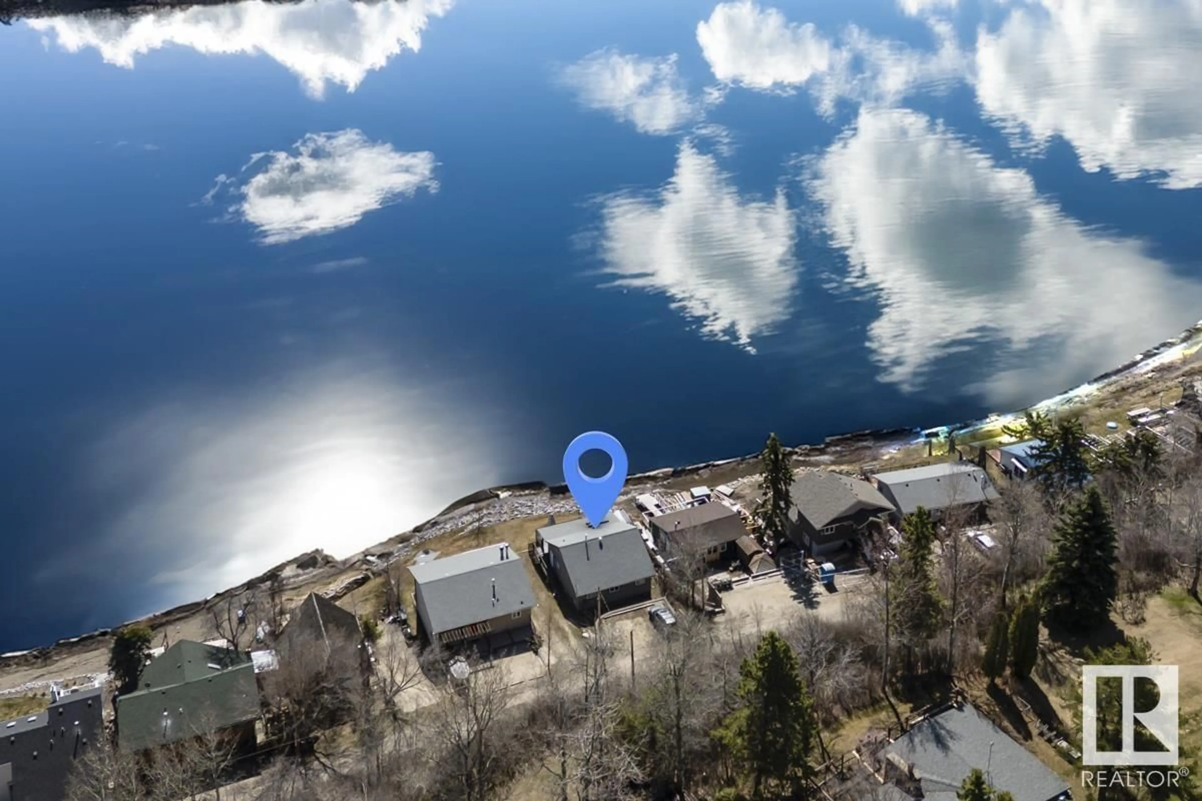 A pic from outside/outdoor area/front of a property/back of a property/a pic from drone, water/lake/river/ocean view for 457 1 AV, Rural Parkland County Alberta T0E2B0