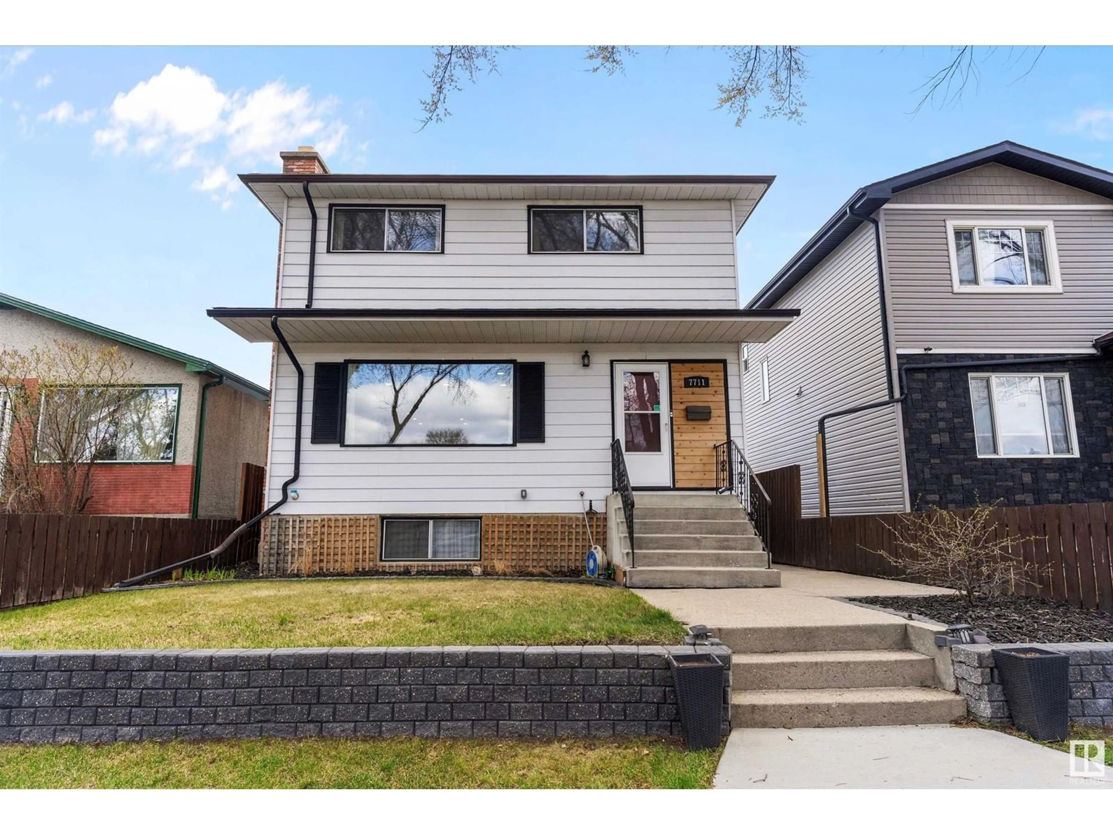 Home with brick exterior material, street for 7711 80 AV, Edmonton Alberta T6C0S3