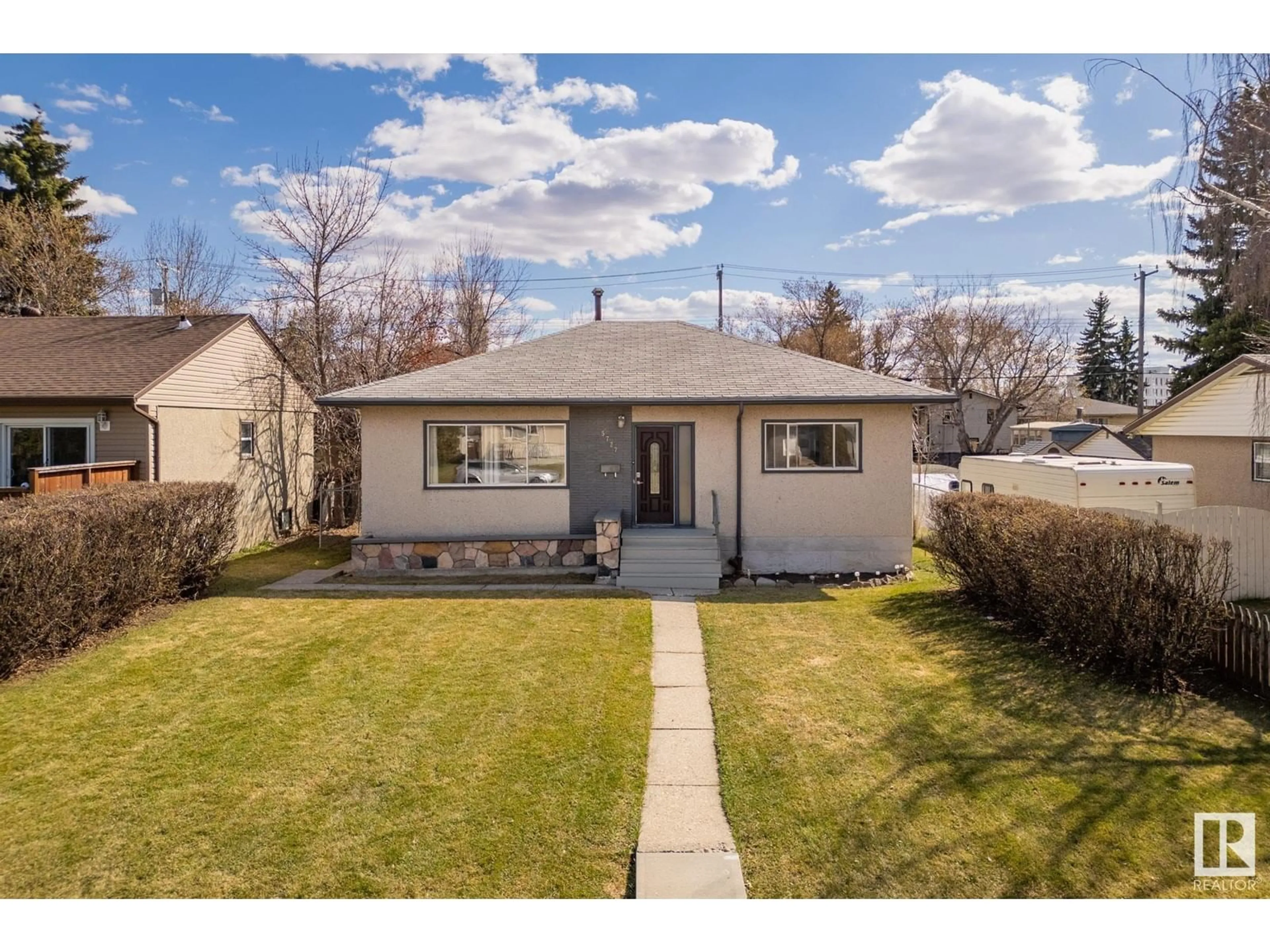 Home with vinyl exterior material, street for 5727 101A AV, Edmonton Alberta T6A0L9