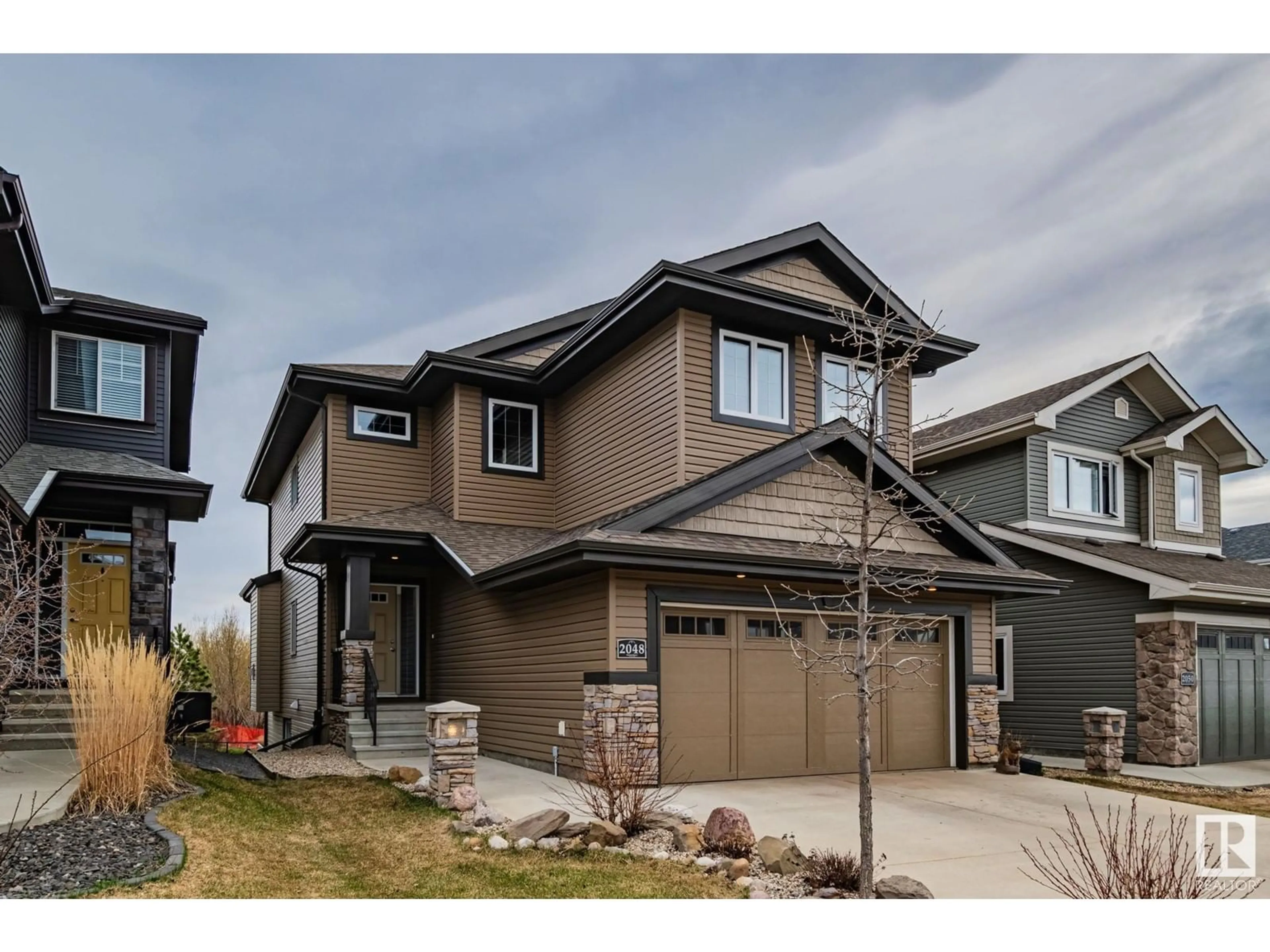 Home with vinyl exterior material, street for NW NW - 2048 REDTAIL CM, Edmonton Alberta T5S0H3