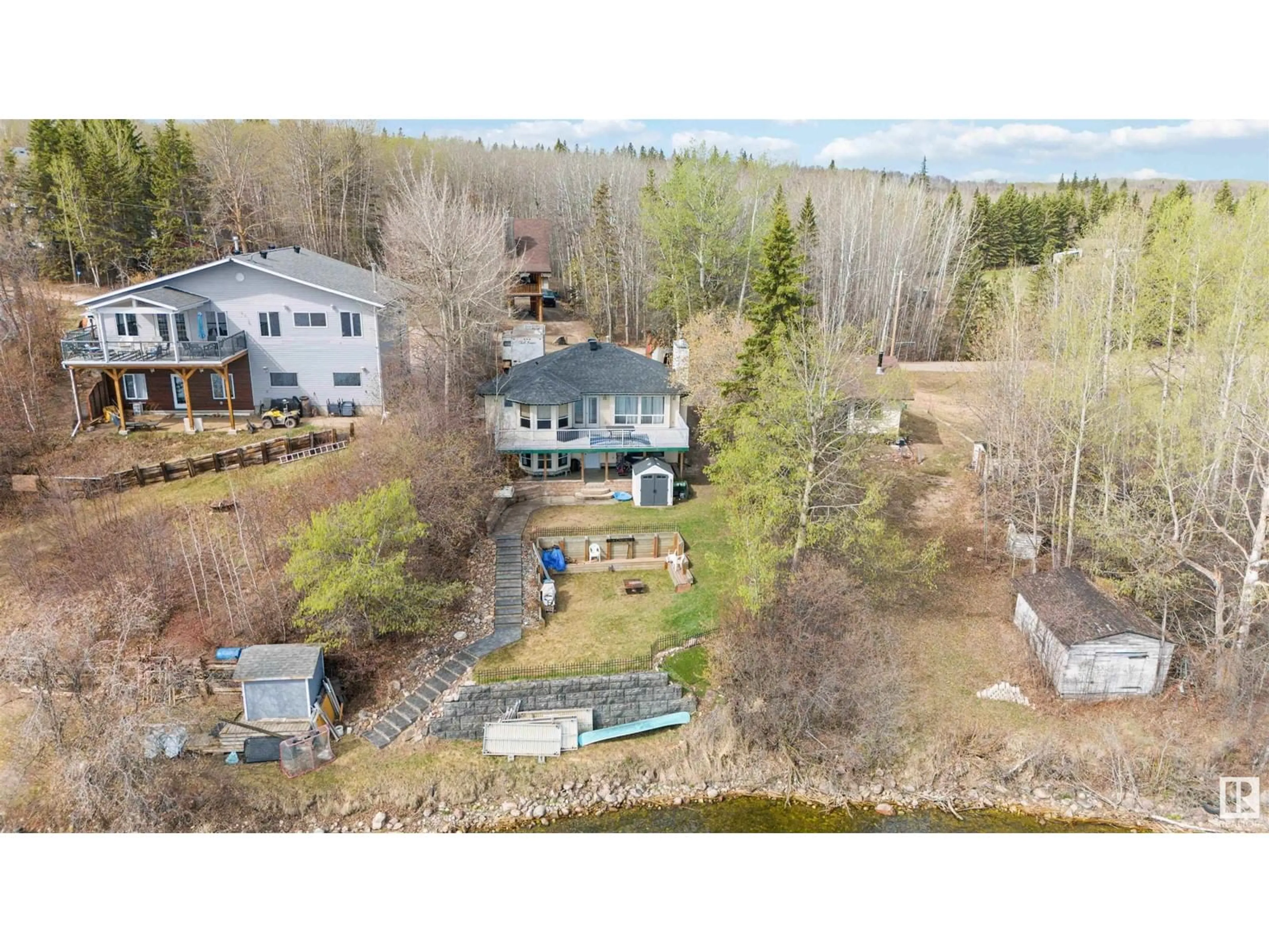 A pic from outside/outdoor area/front of a property/back of a property/a pic from drone, water/lake/river/ocean view for 109 - 3215 TWP RD 574, Rural Lac Ste. Anne County Alberta T0G1L2