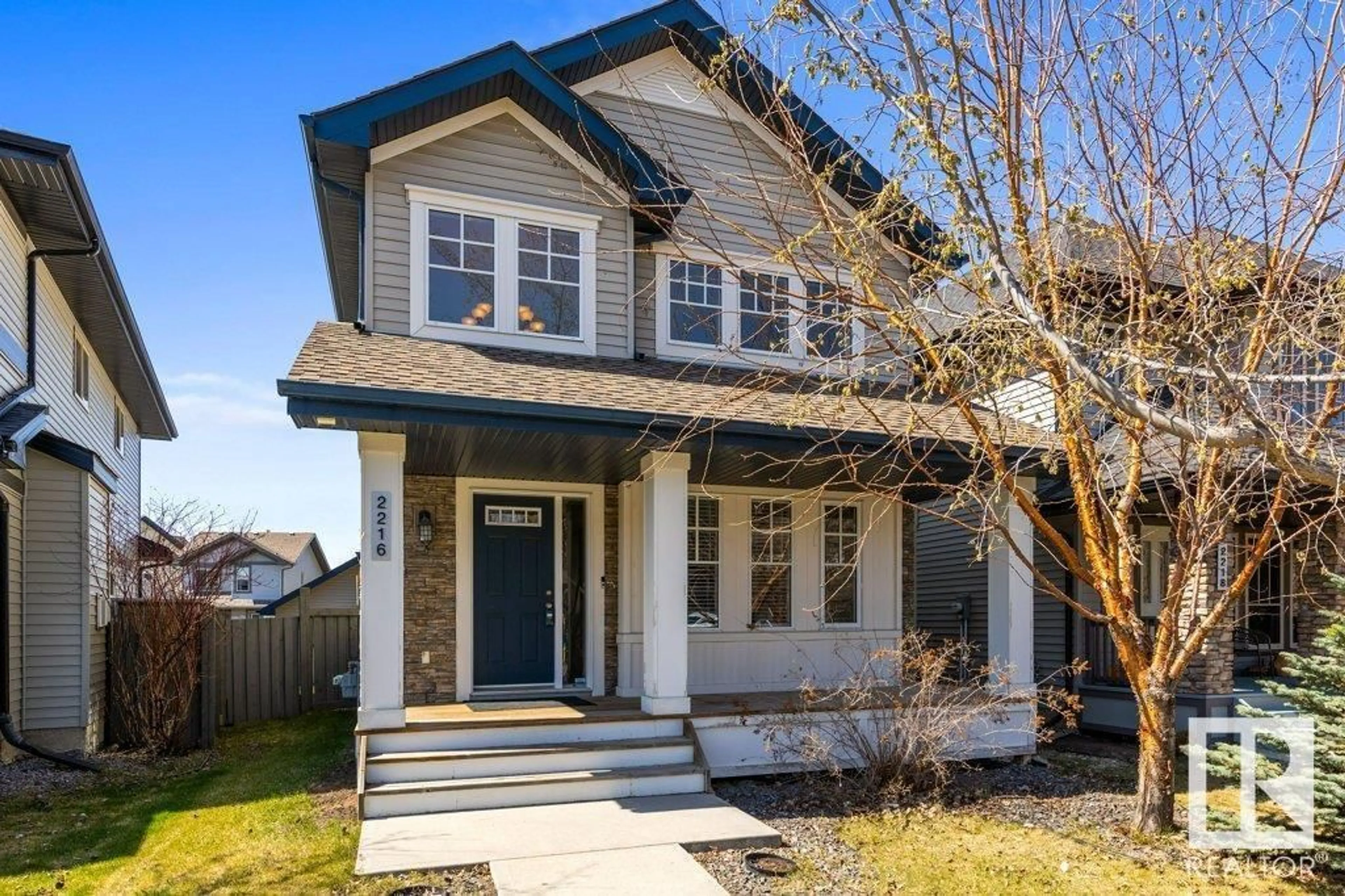 Home with vinyl exterior material, street for 2216 AUSTIN WY, Edmonton Alberta T6W0L2