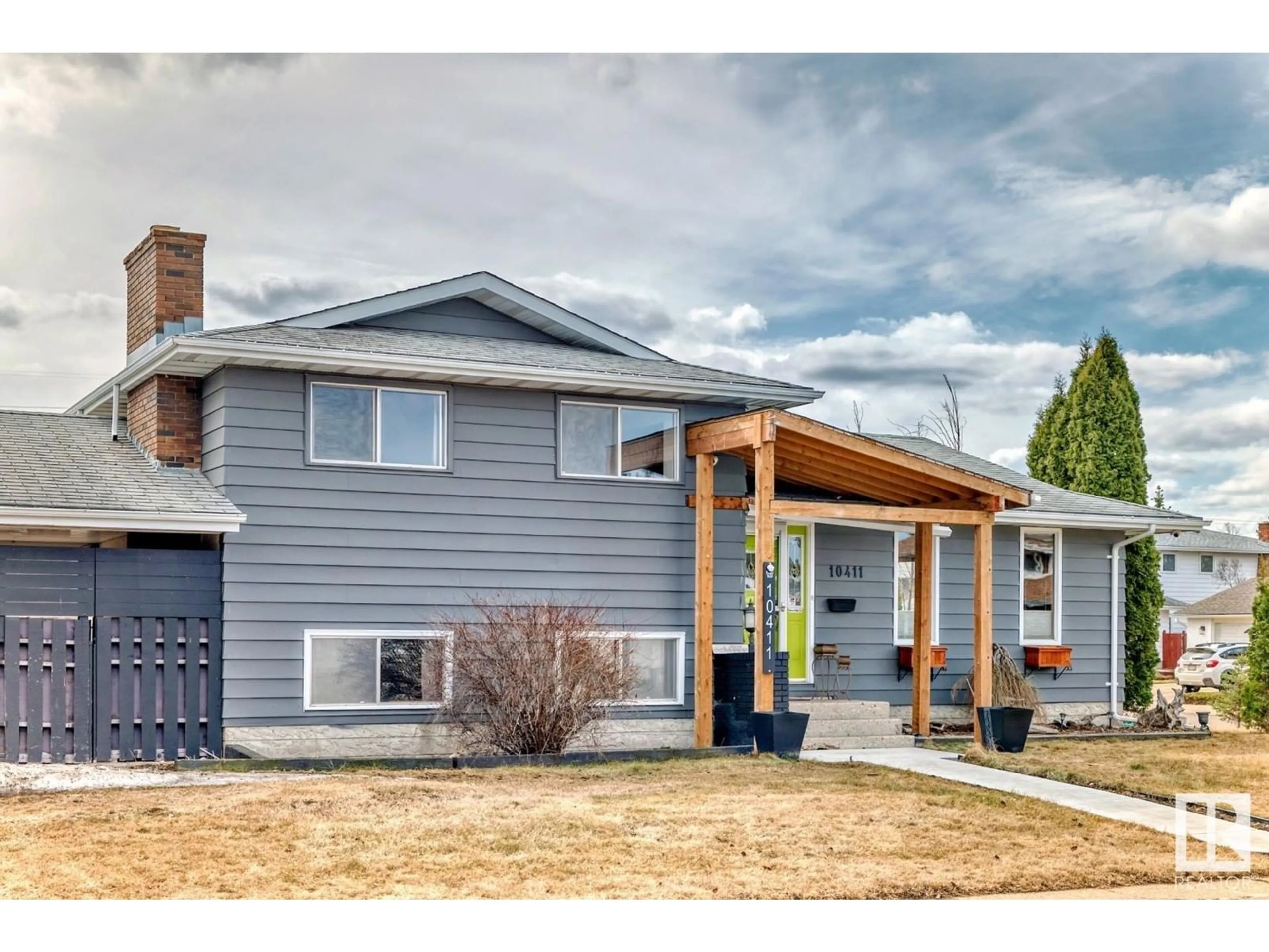 Home with vinyl exterior material, street for 10411 31 AV, Edmonton Alberta T6J3K2