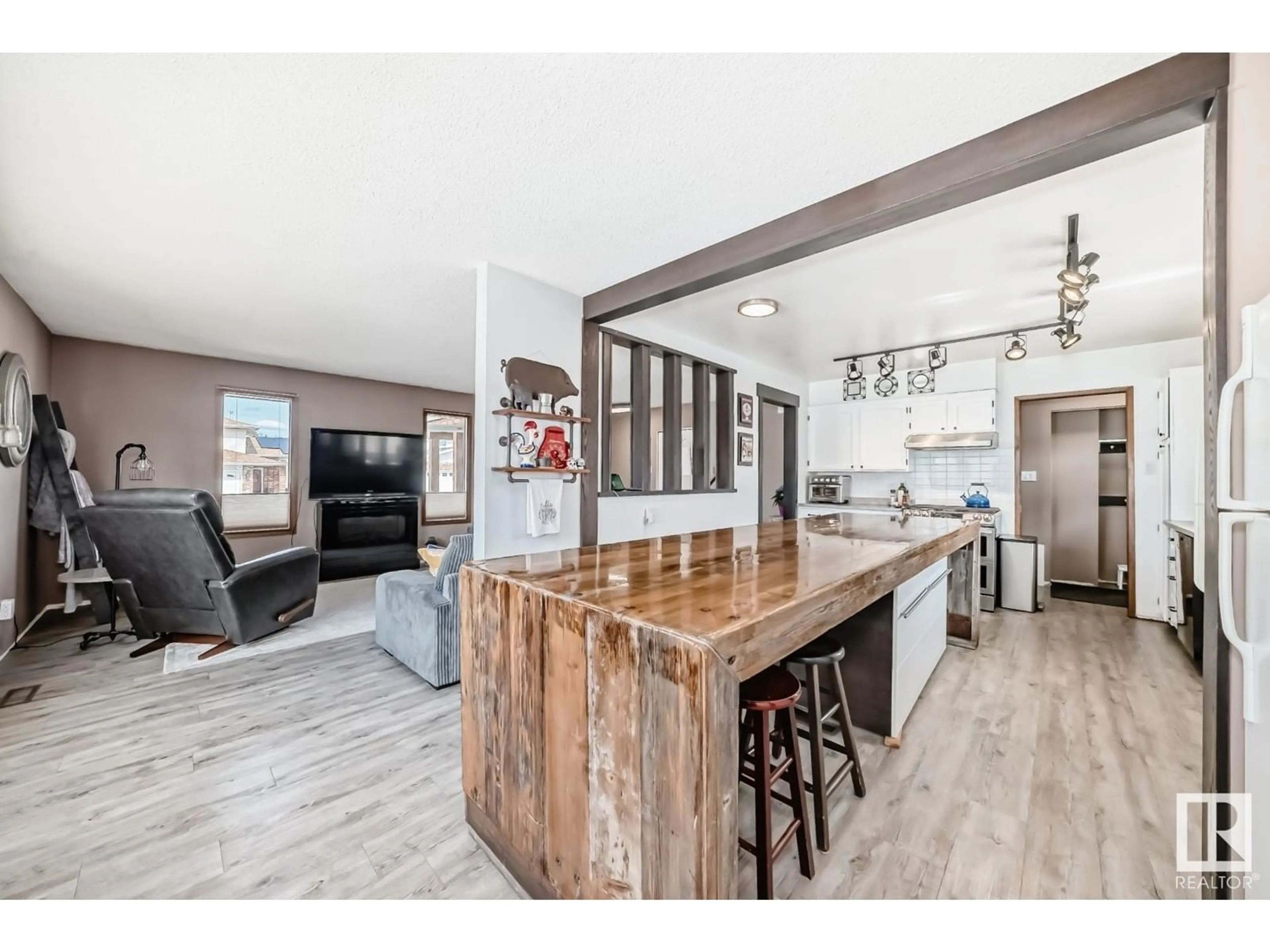 Open concept kitchen, wood/laminate floor for 10411 31 AV, Edmonton Alberta T6J3K2
