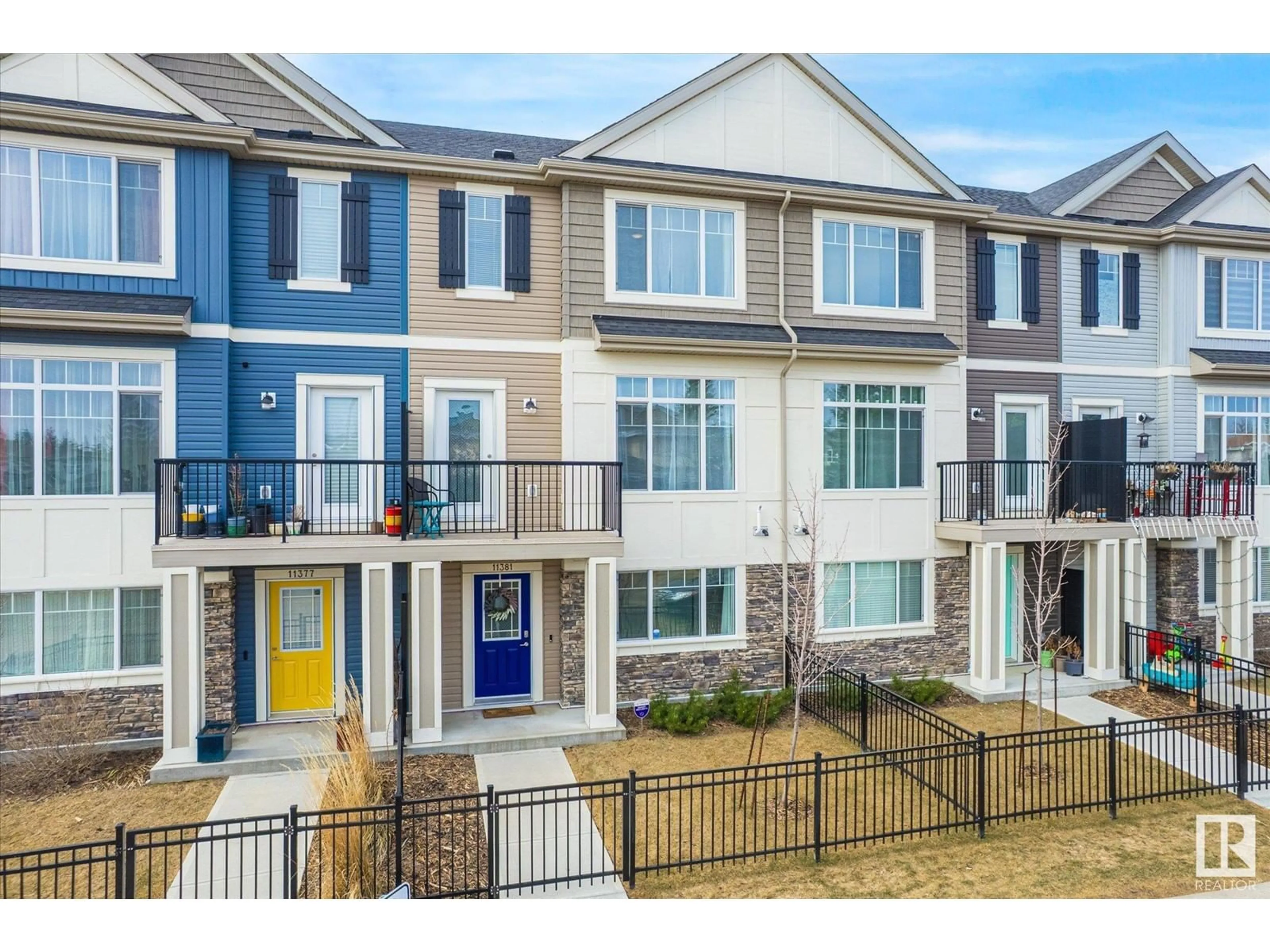 Home with vinyl exterior material, street for 11381 12 AV, Edmonton Alberta T6J5V2
