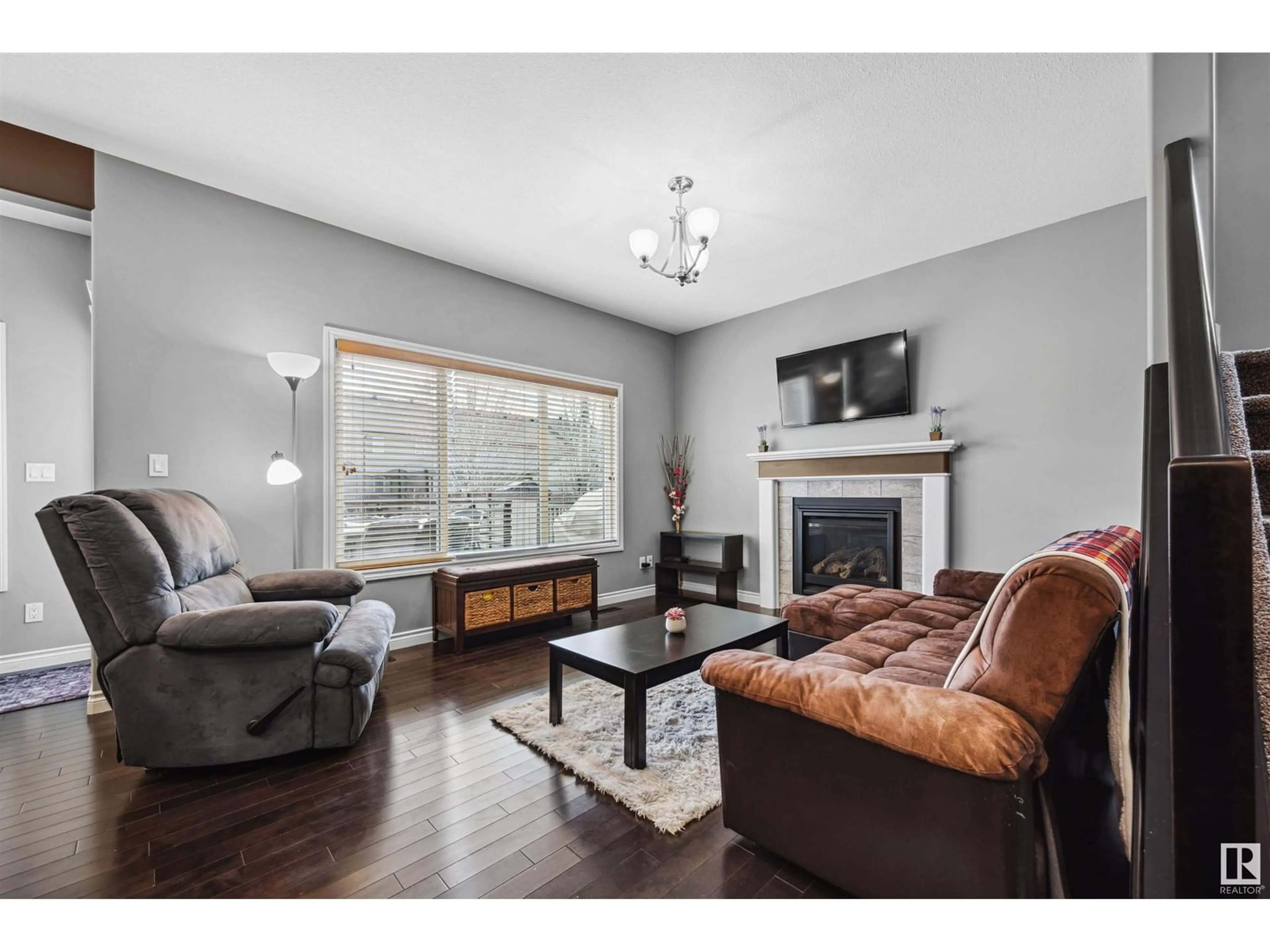 Living room with furniture, wood/laminate floor for SW - 3727 KIDD CR, Edmonton Alberta T6W2R1