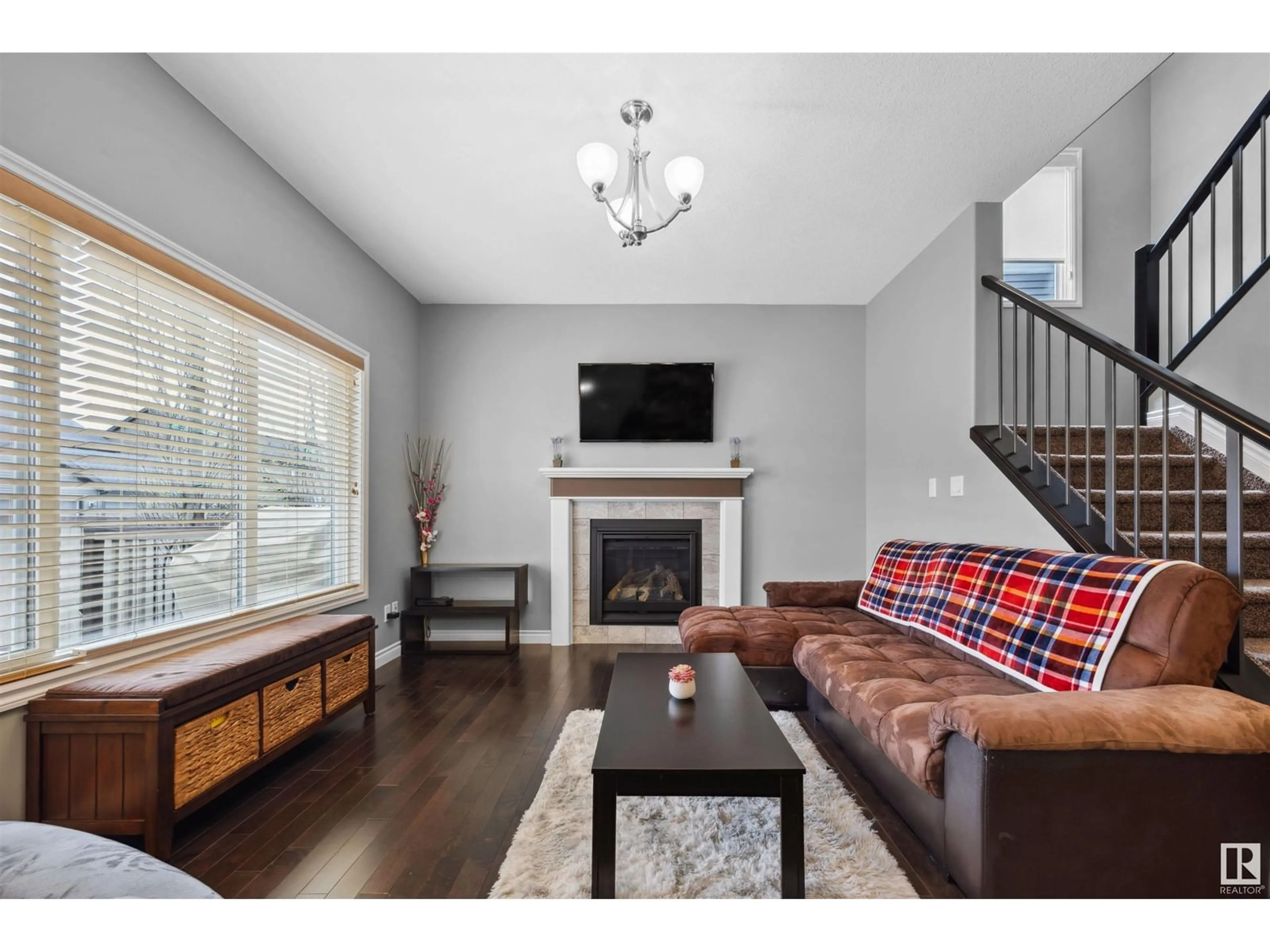 Living room with furniture, wood/laminate floor for SW - 3727 KIDD CR, Edmonton Alberta T6W2R1