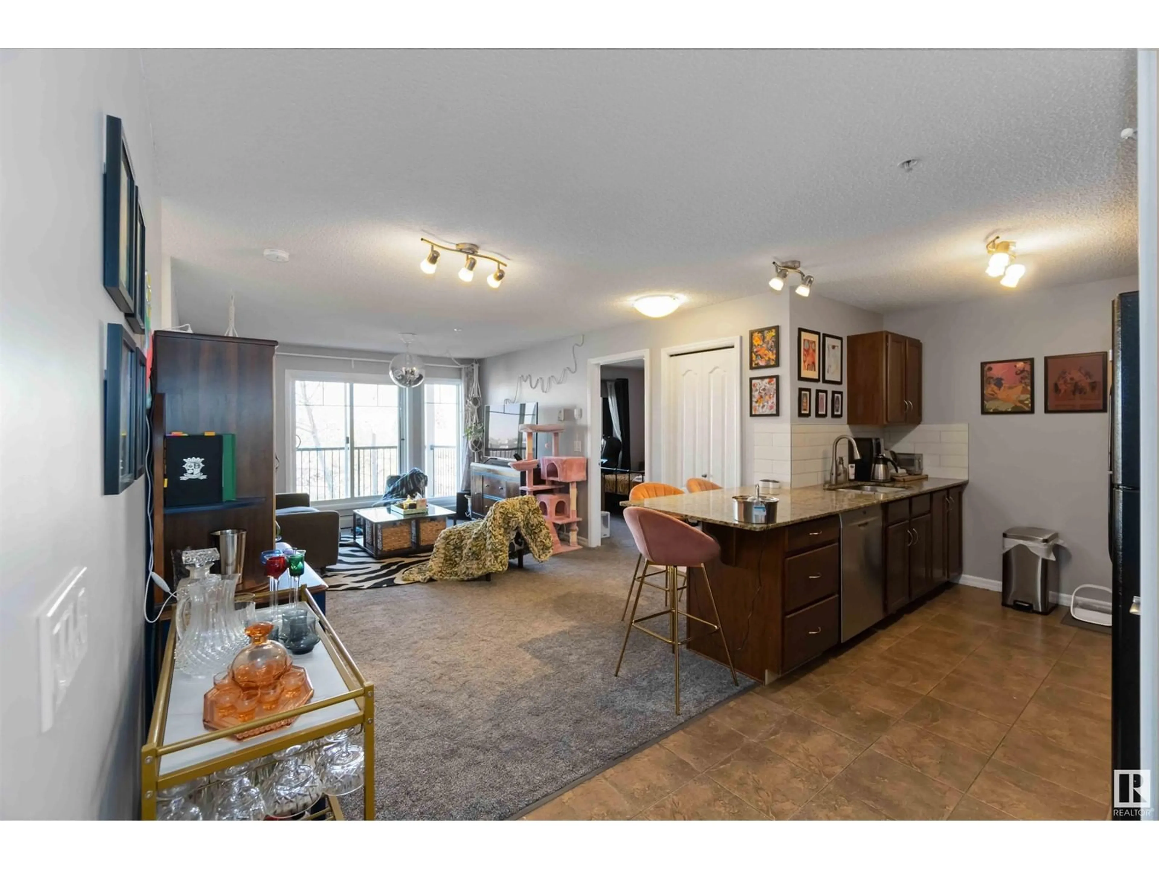 Living room with furniture, wood/laminate floor for 312 - 273 CHARLOTTE WY, Sherwood Park Alberta T8H0N9