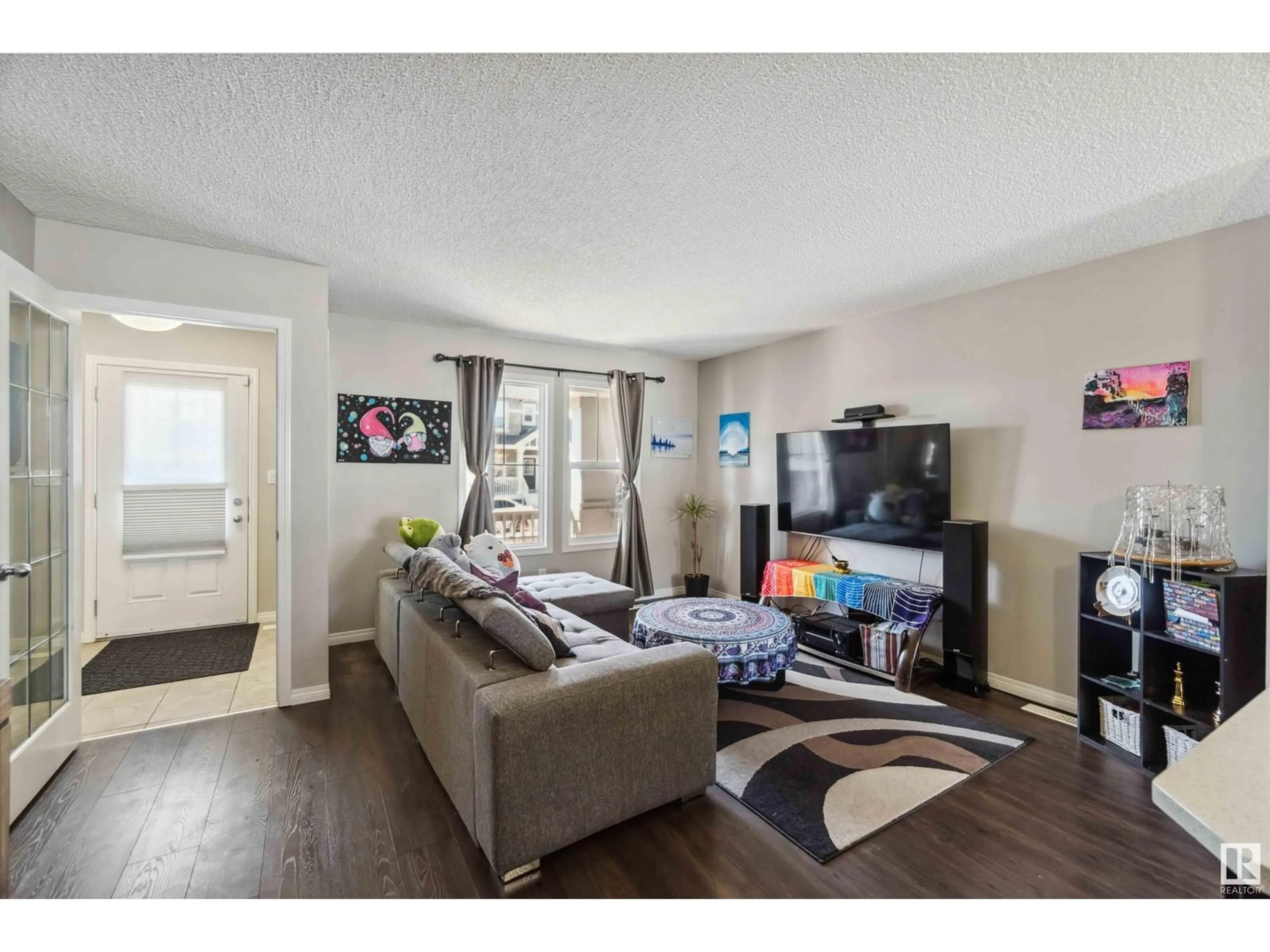 Living room with furniture, wood/laminate floor for 3439 CHERRY WY, Edmonton Alberta T6X2B6