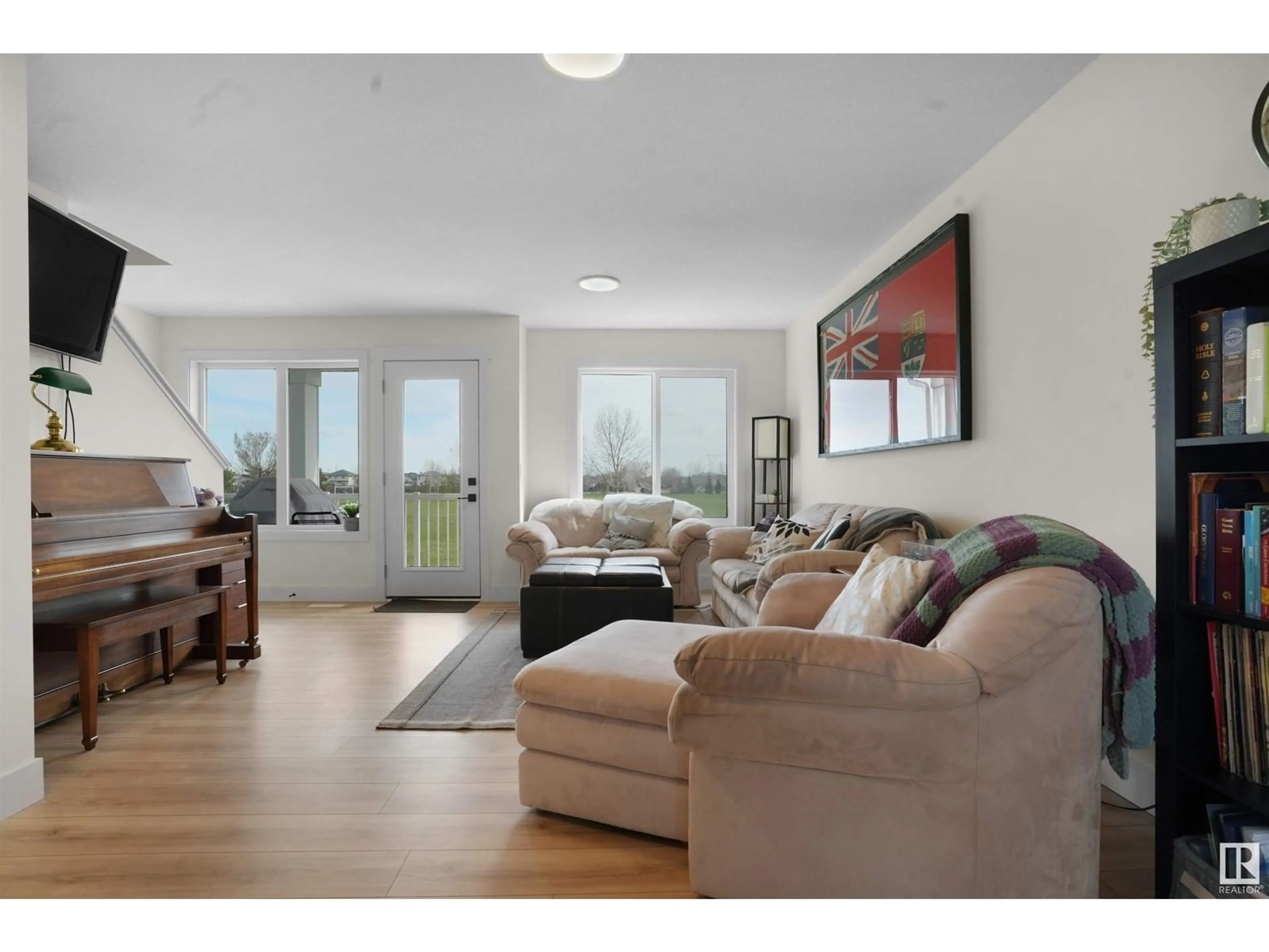 Living room with furniture, wood/laminate floor for Unit 66 - 16335 84 ST, Edmonton Alberta T5Z0S2