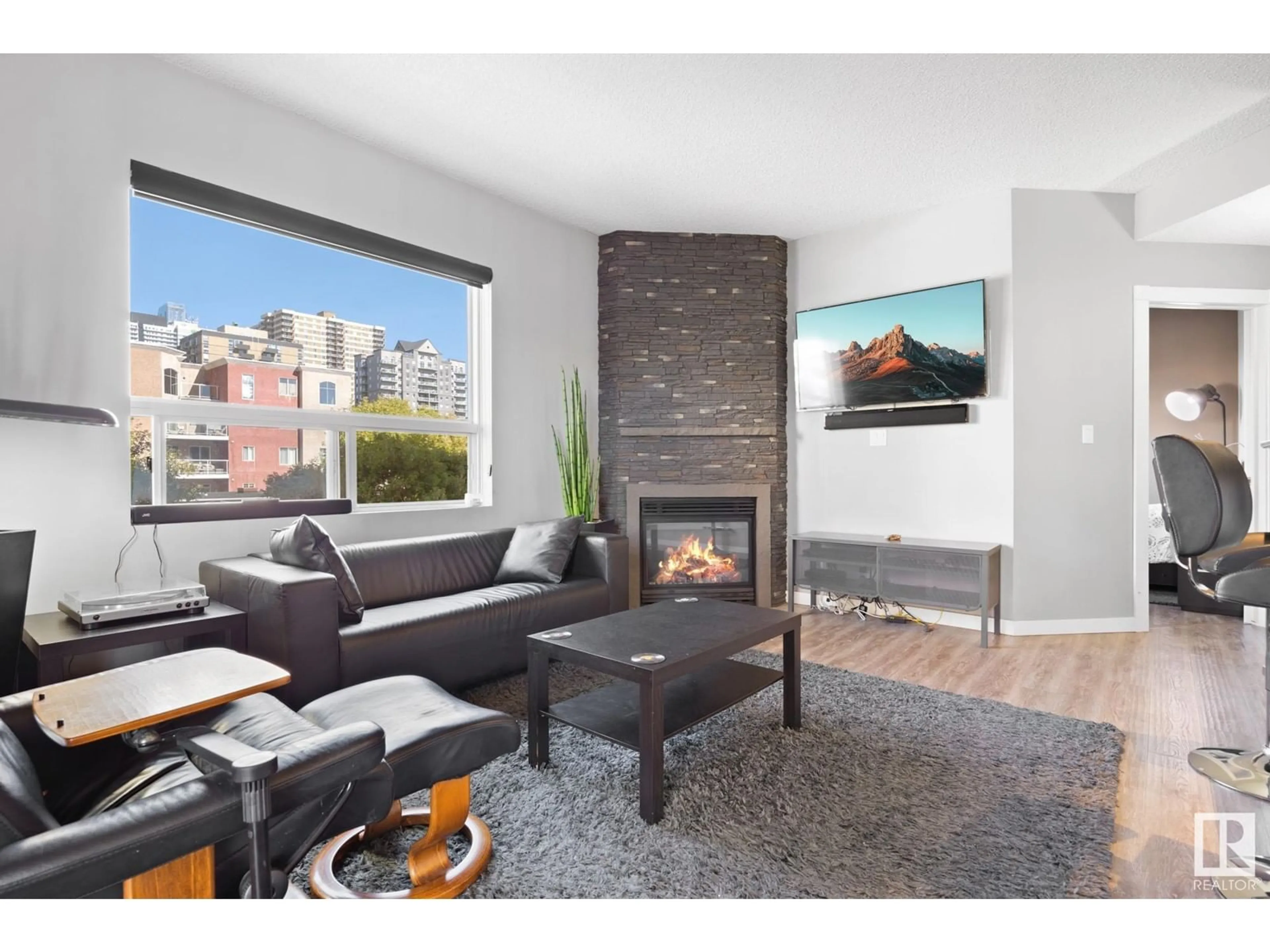 Living room with furniture, wood/laminate floor for #402 - 9707 105 ST, Edmonton Alberta T5K2Y4