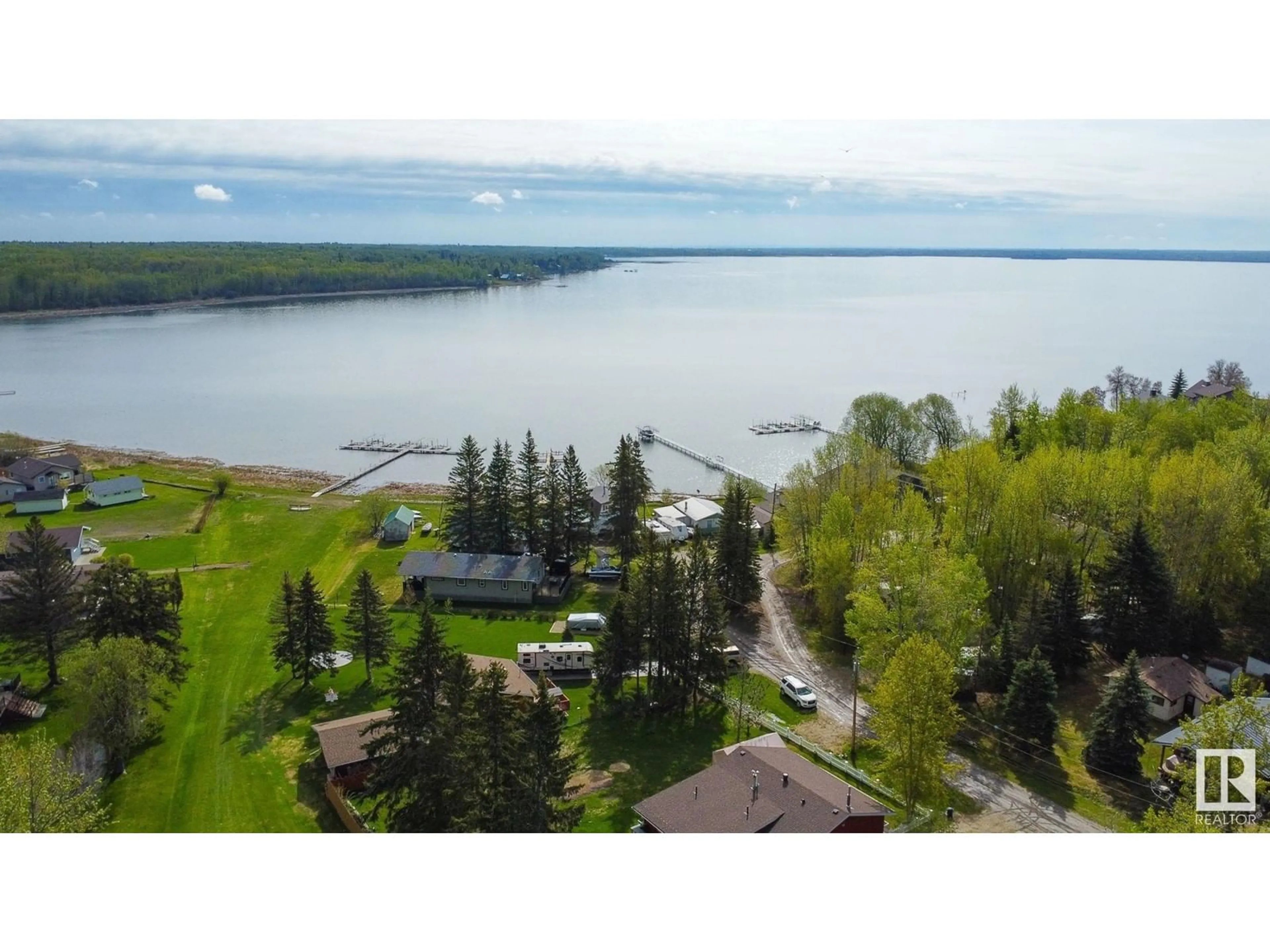 A pic from outside/outdoor area/front of a property/back of a property/a pic from drone, water/lake/river/ocean view for 305 3 ST, Rural Lac Ste. Anne County Alberta T0A0E0