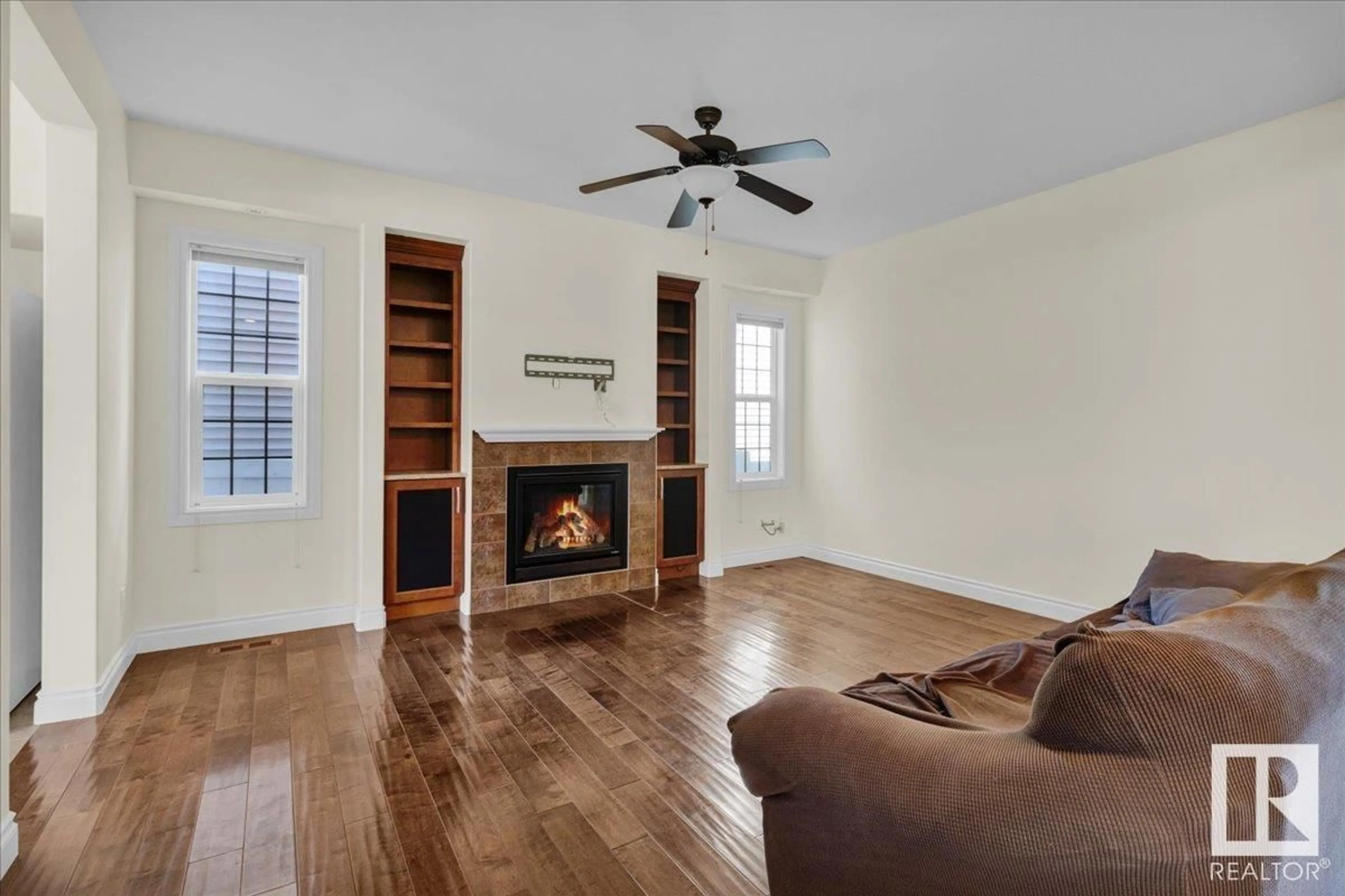 Living room with furniture, wood/laminate floor for 5512 CONESTOGA ST, Edmonton Alberta T5E6R6