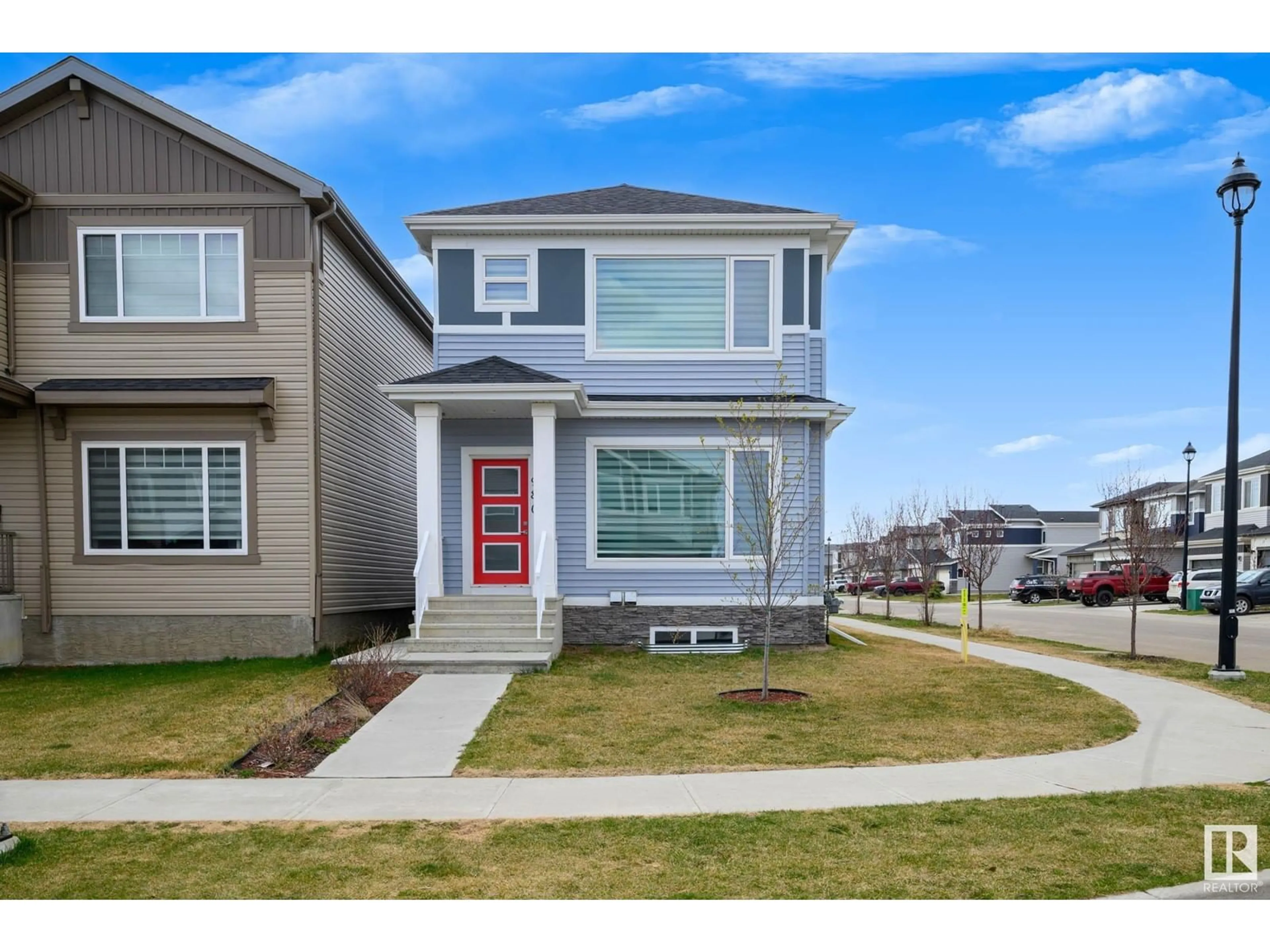 Home with vinyl exterior material, street for 980 BERG PL, Leduc Alberta T9E1L8