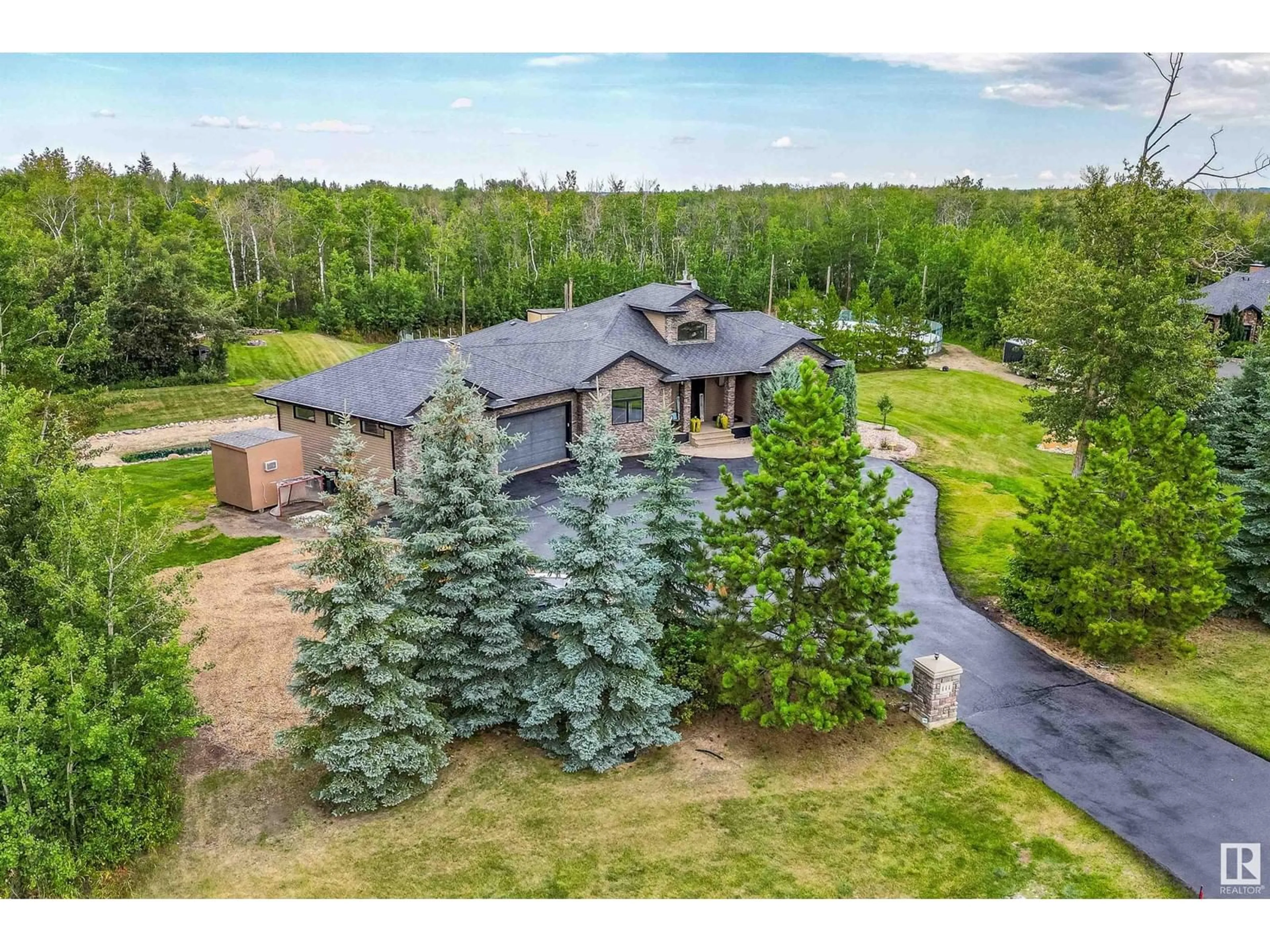 A pic from outside/outdoor area/front of a property/back of a property/a pic from drone, mountain view for 53025 RGE RD 223, Rural Strathcona County Alberta T8E2M3