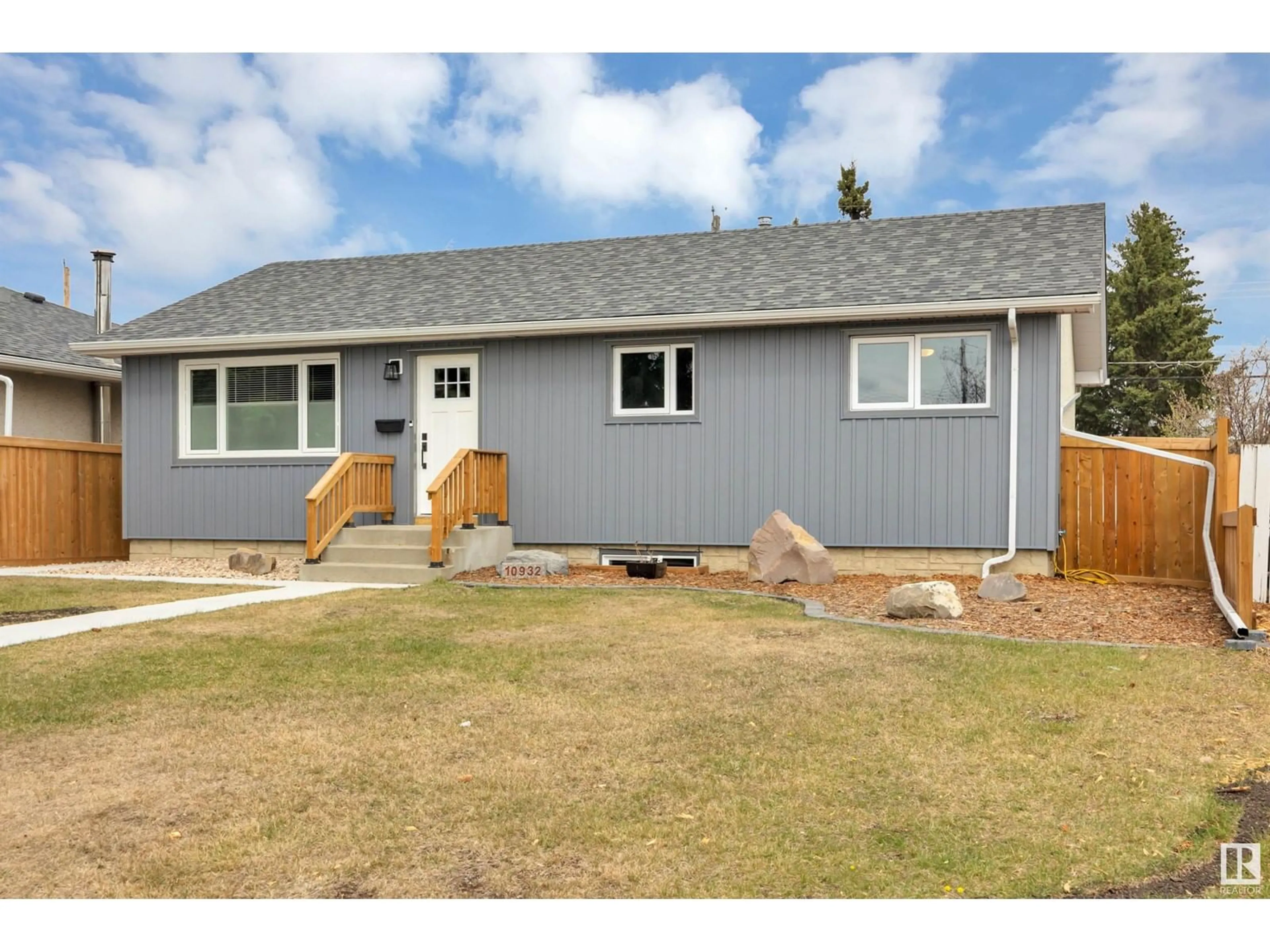 Home with vinyl exterior material, street for 10932 136 AV, Edmonton Alberta T5E1W7
