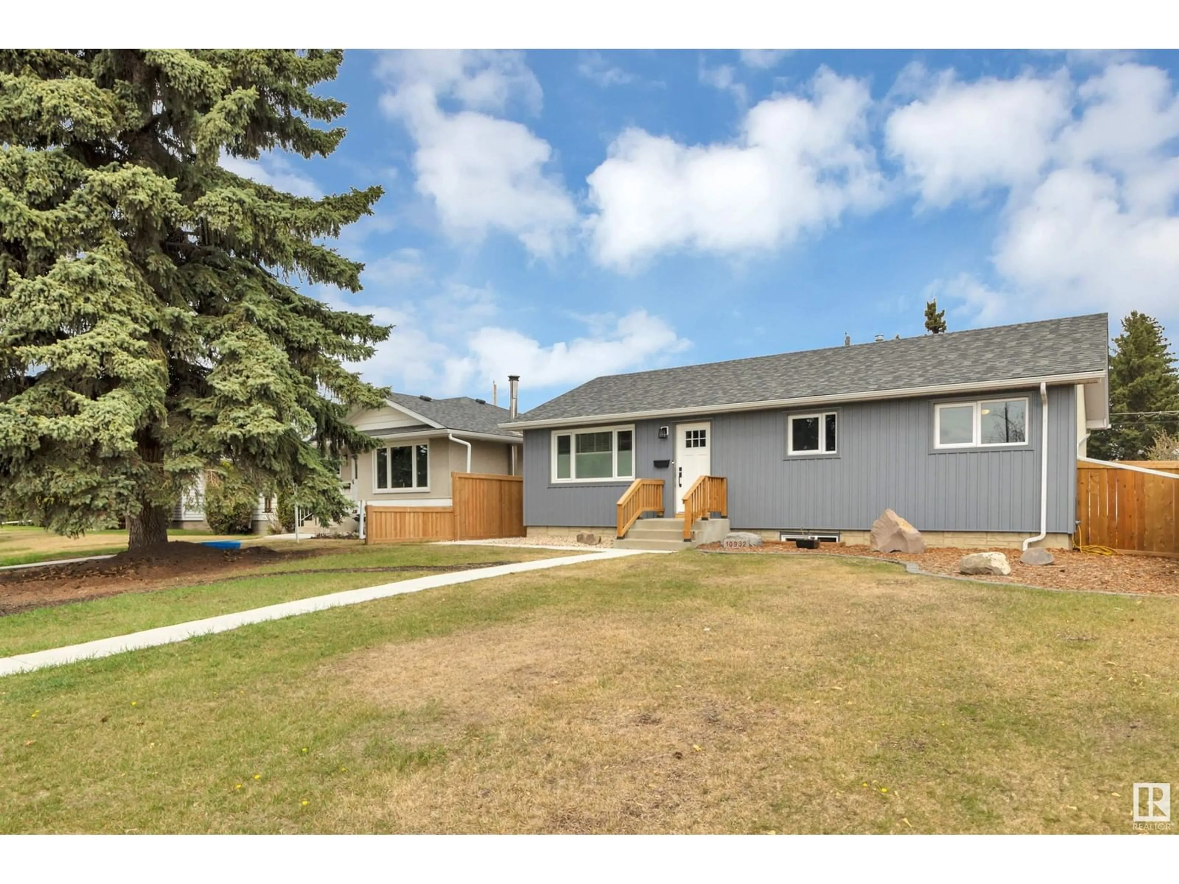Home with vinyl exterior material, street for 10932 136 AV, Edmonton Alberta T5E1W7