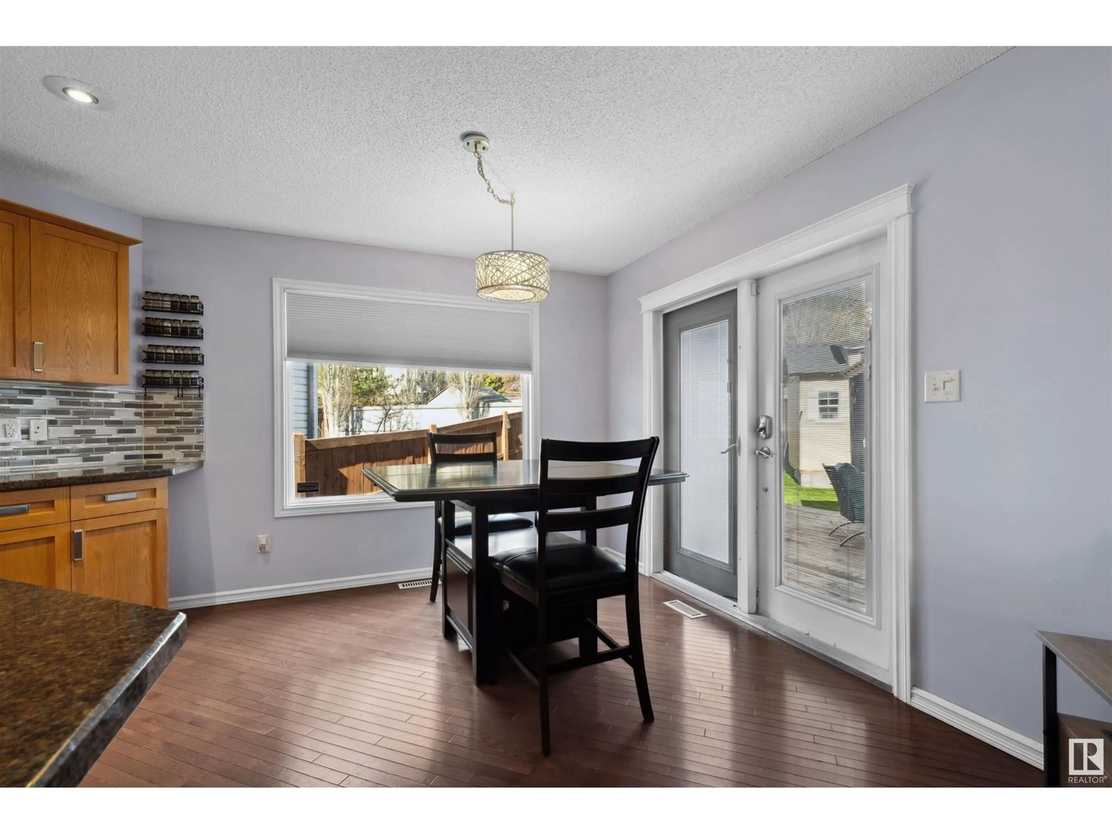 Dining room, wood/laminate floor for 8918 179A AV, Edmonton Alberta T5Z0A6
