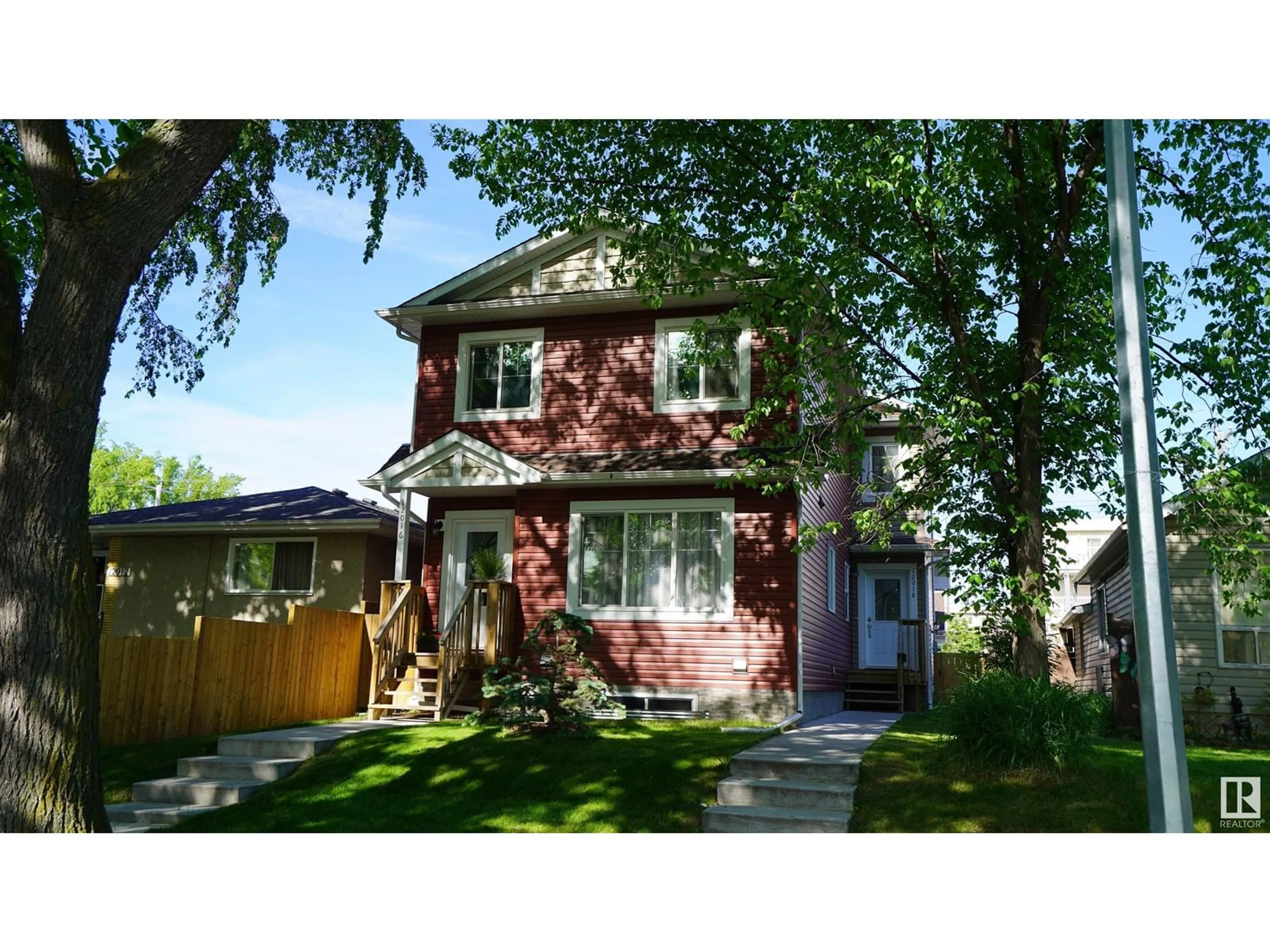 Home with vinyl exterior material, street for 12018 65 ST, Edmonton Alberta T5W4L7