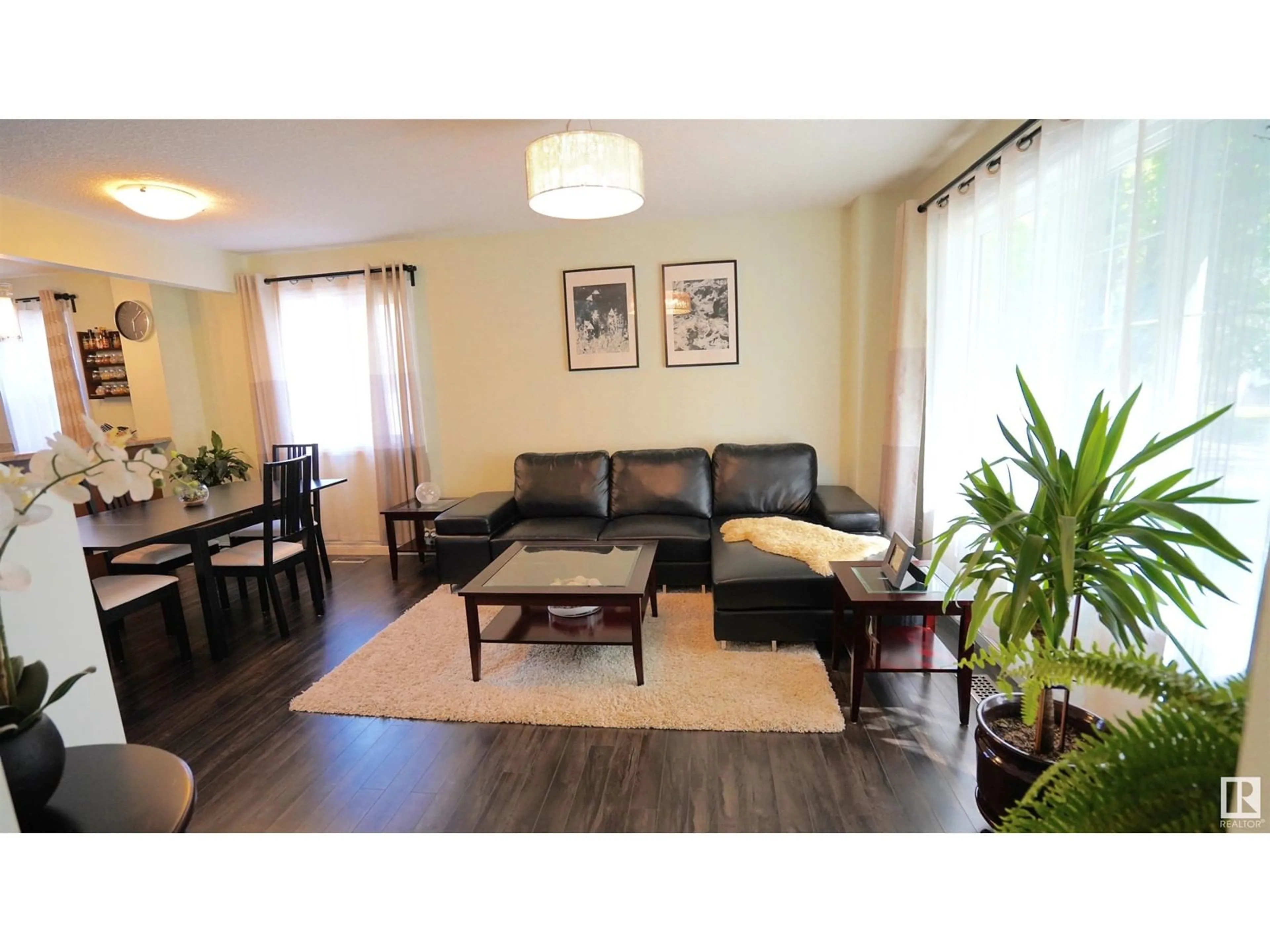 Living room with furniture, wood/laminate floor for 12018 65 ST, Edmonton Alberta T5W4L7