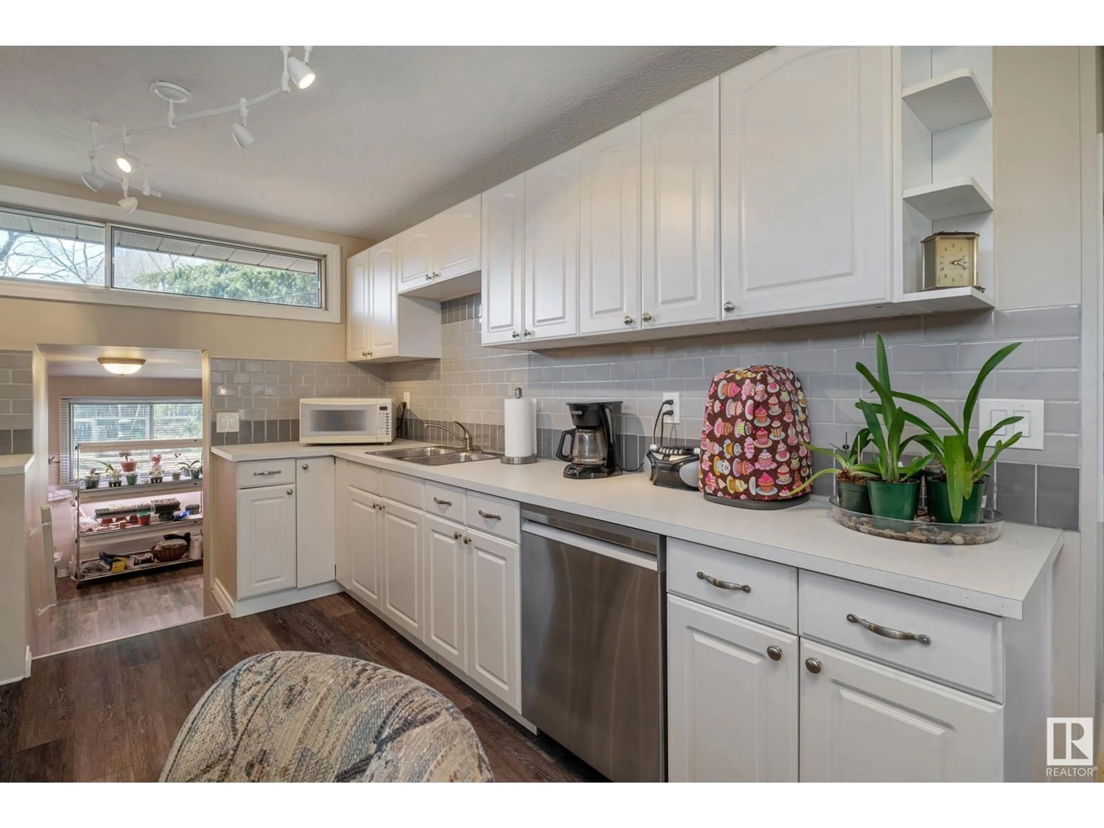 Open concept kitchen, wood/laminate floor for NW - 9712 162 ST, Edmonton Alberta T5P3K9