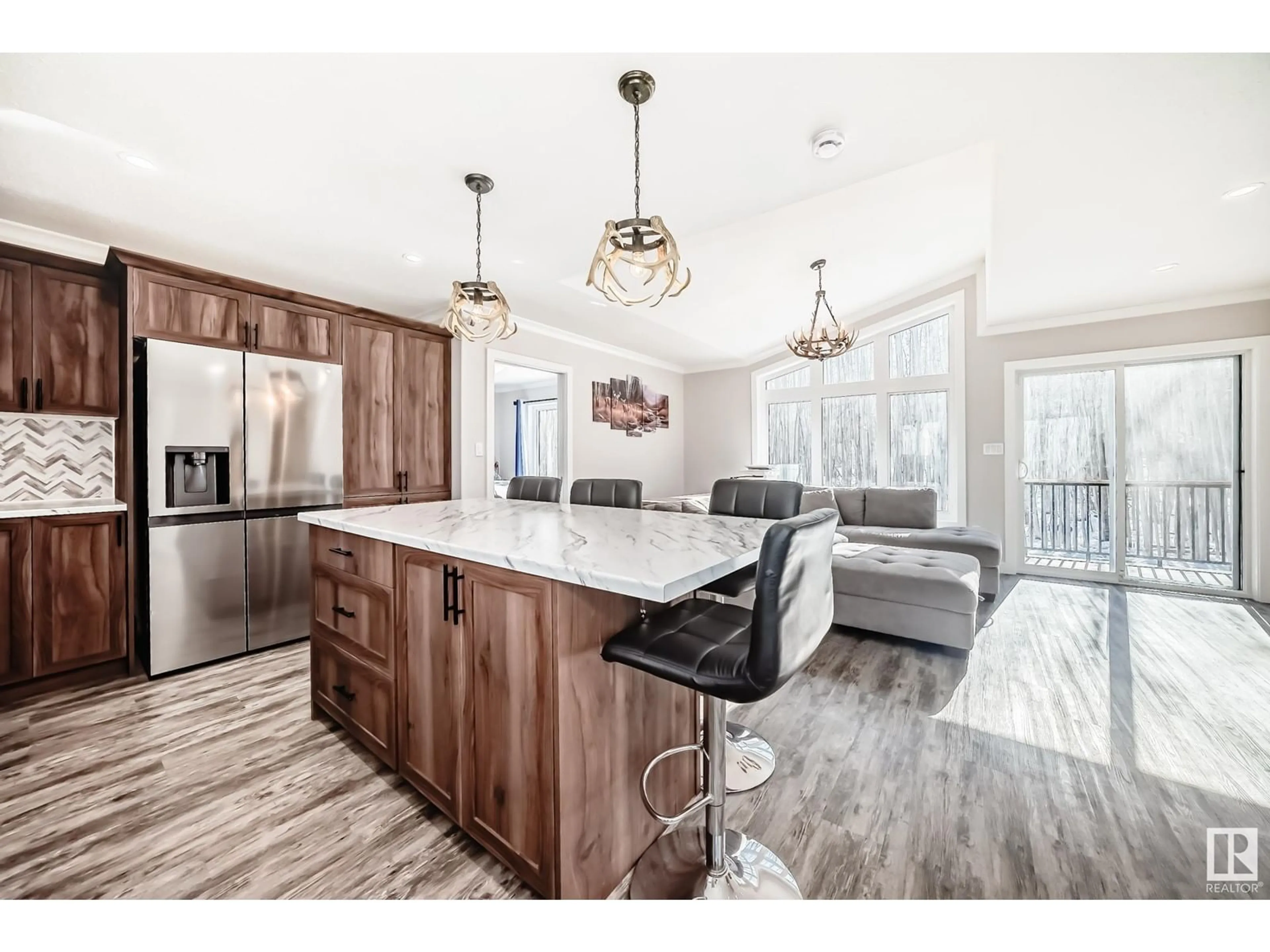 Open concept kitchen, wood/laminate floor for 473060 - 304 RGE RD 280 RGE RD, Rural Wetaskiwin County Alberta T0C2C0