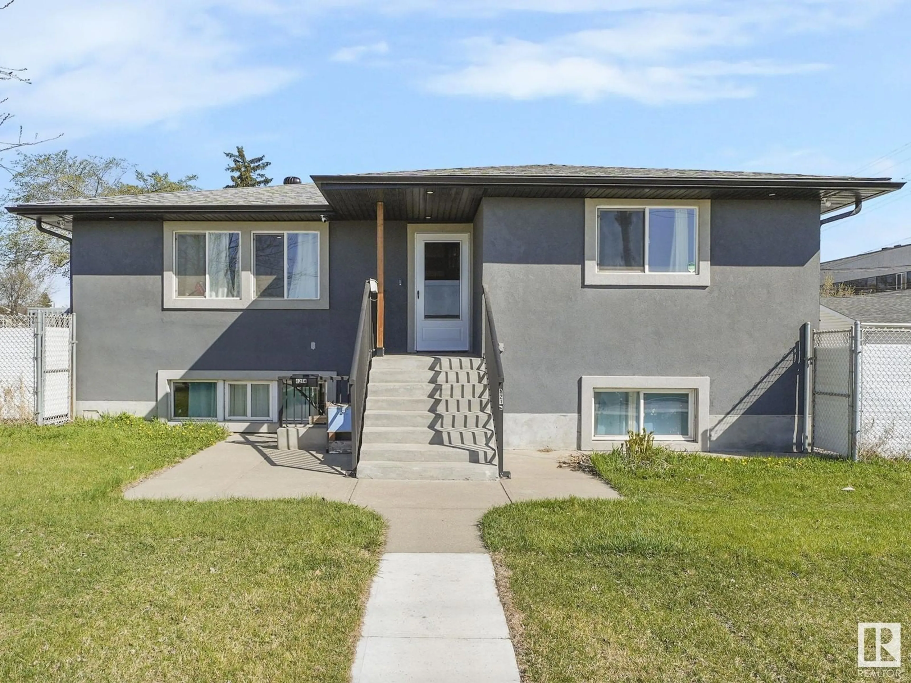 Home with vinyl exterior material, street for 8214 127 AV, Edmonton Alberta T5E0A2