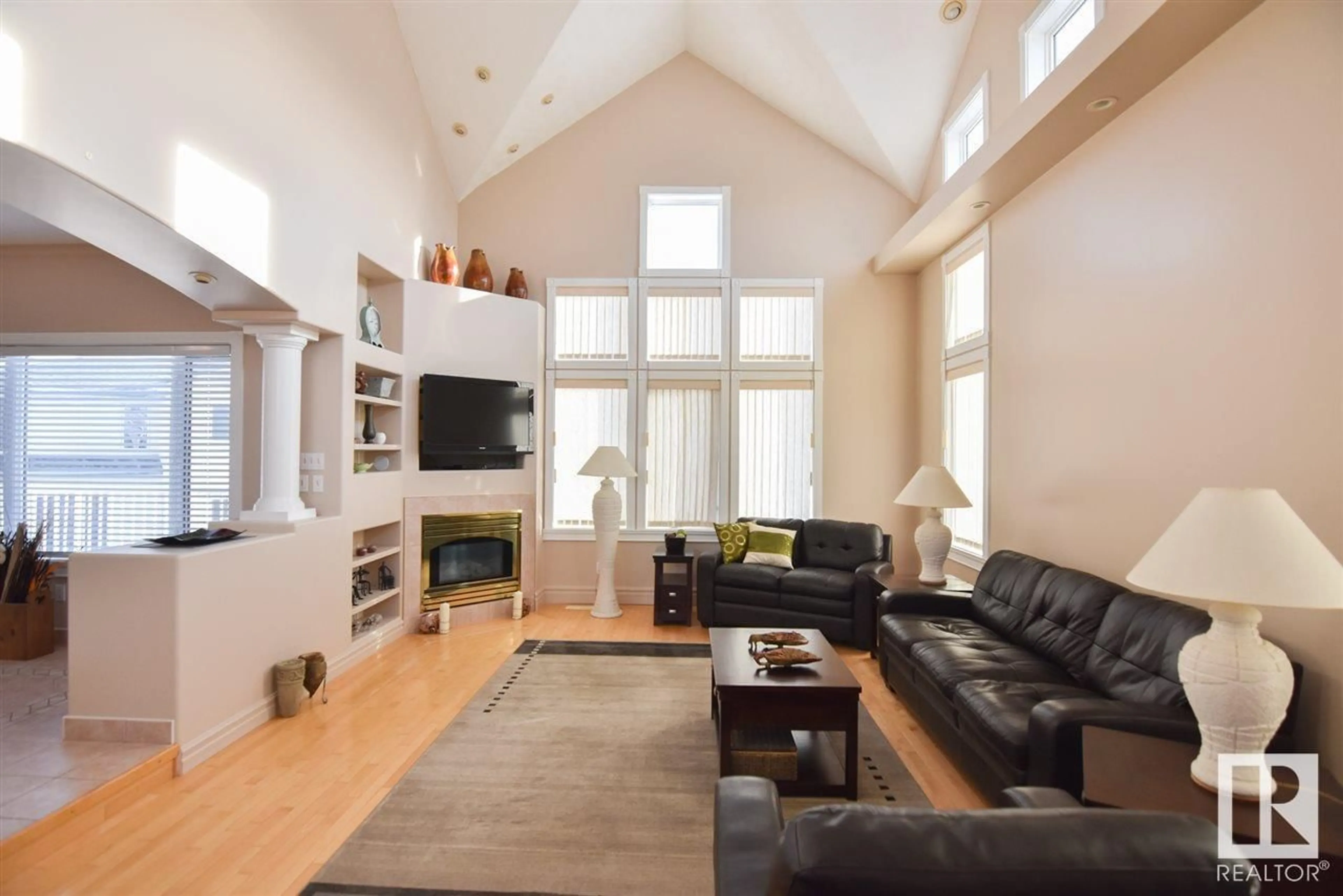 Living room with furniture, wood/laminate floor for 16115 57 ST, Edmonton Alberta T5Y2T1