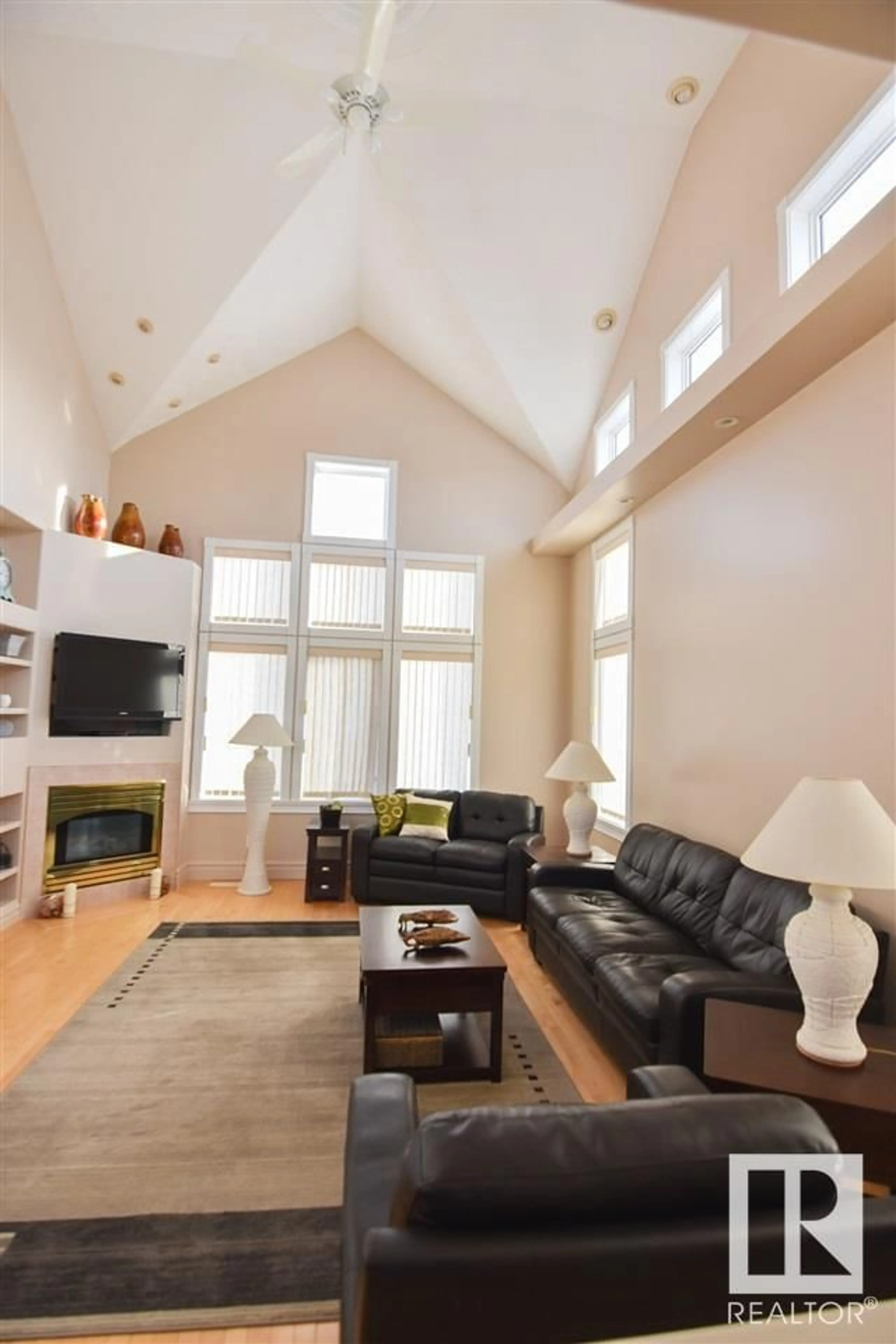 Living room with furniture, wood/laminate floor for 16115 57 ST, Edmonton Alberta T5Y2T1
